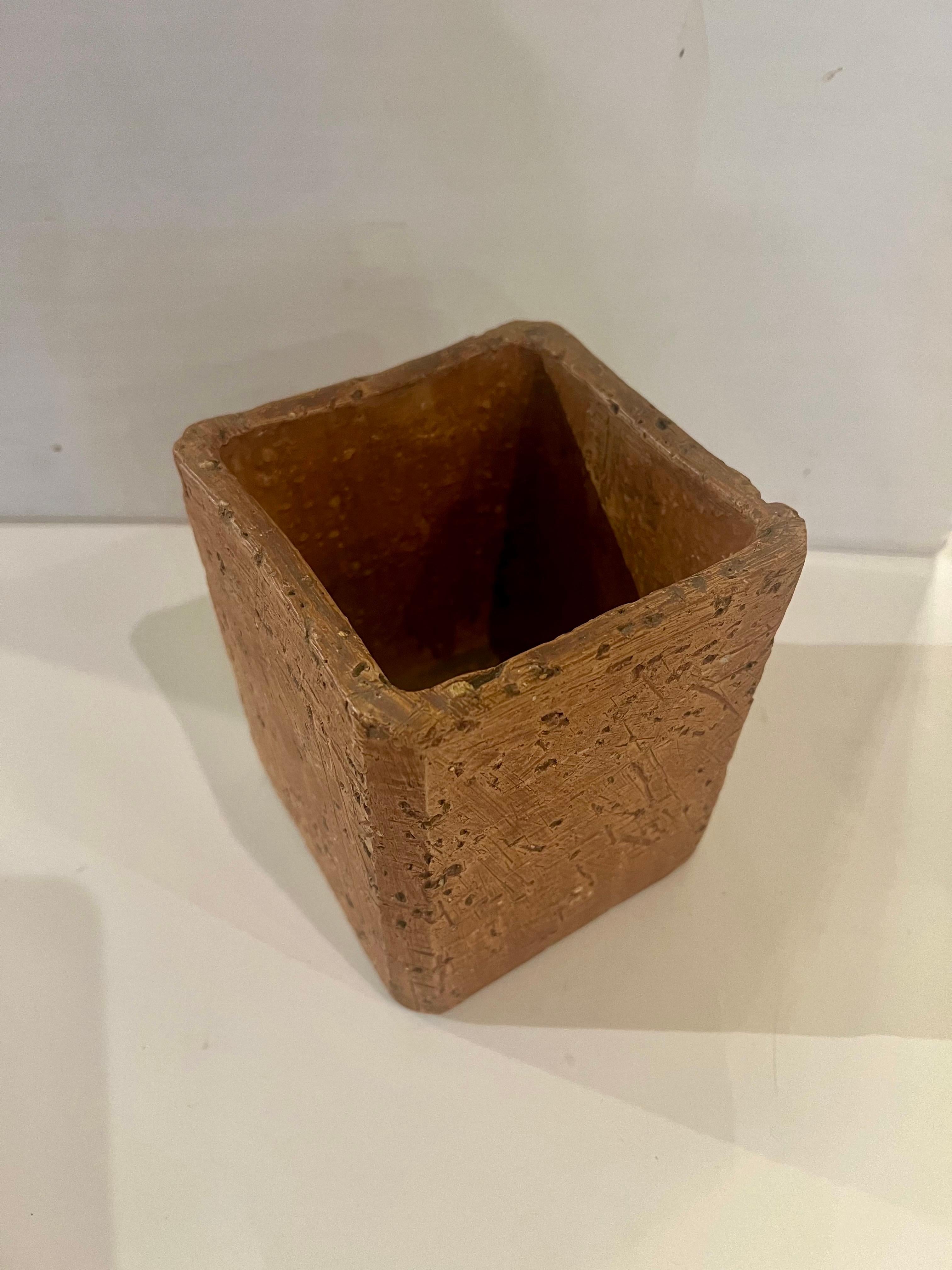 A rare terracotta minimalist planter with textured finish planter vase stamped at the botto post war  , made in West Germany. Danish Modern Mid century Boho Home decor.