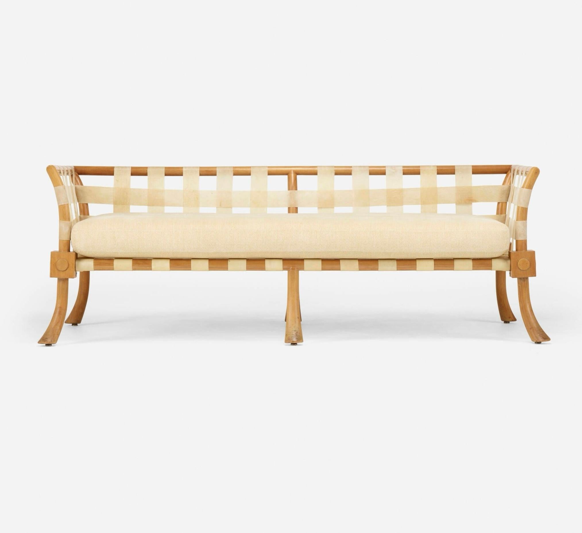 A rare, likely custom ordered Sofa or Settee, designed by T.H. Robsjohn Gibbings with a bleached Walnut frame and Vellum Strapping. Stunning, elegant neo-classical design.  One long cushion on bottom. We’ve had 4 new cushions made for the back. The