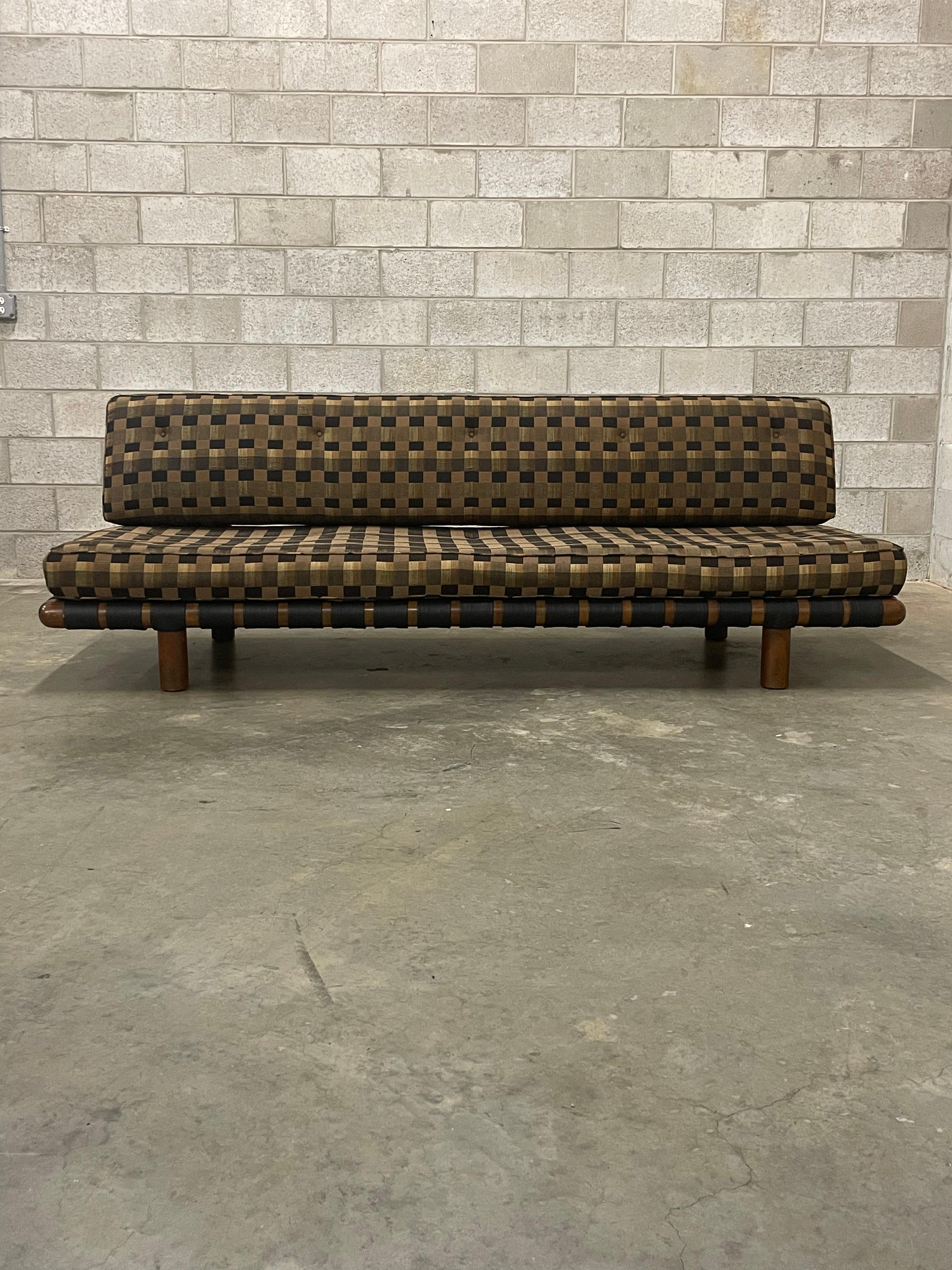 A wonderful, iconic, and rare sofa designed by T.H. Robsjohn-Gibbings for Widdicomb. Sofa has a minimalist silhouette while maintaining a sophisticated nature. Here is a rare opportunity to save on cost and transform one through reupholstery.