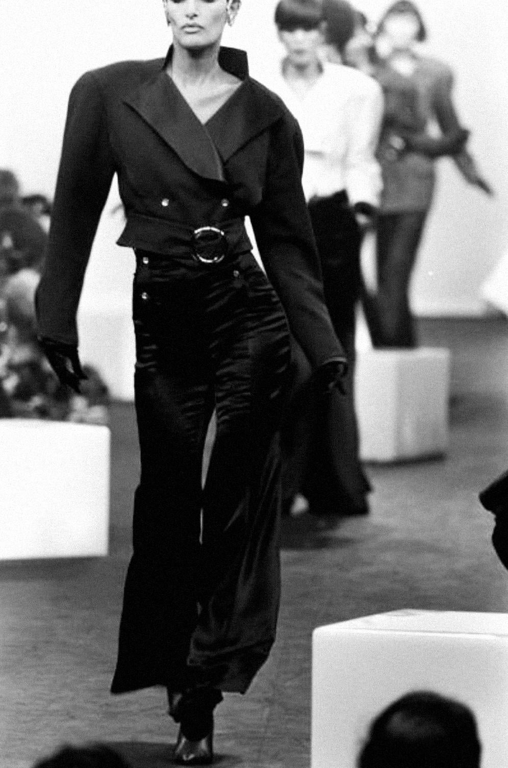 Beautiful rare Thierry Mugler jacket, FW 1985 Collection. Stunning Collectors piece, well documented on the '85 Runway Show.
This jacket is pure sculptural intent - a masterclass in tailoring that redefined the silhouette of the decade. Engineered