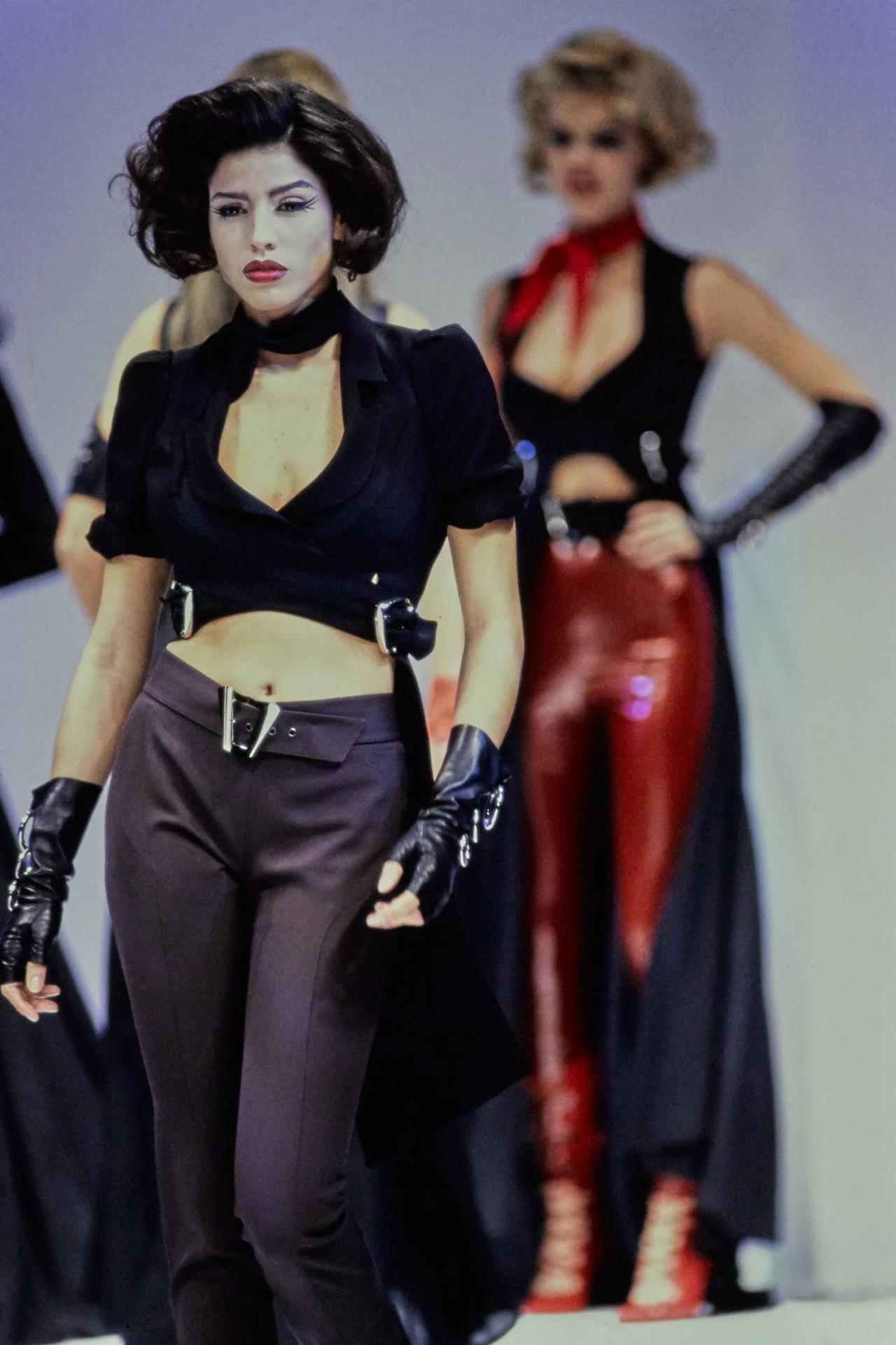 Thierry Mugler SS 1992 Collection Runway Piece
This rare jacket exemplifies the iconic avant-garde yet sharply tailored aesthetic for which Manfred Thierry Mugler was renowned. Crafted in a sleek black fabric, the piece blends architectural