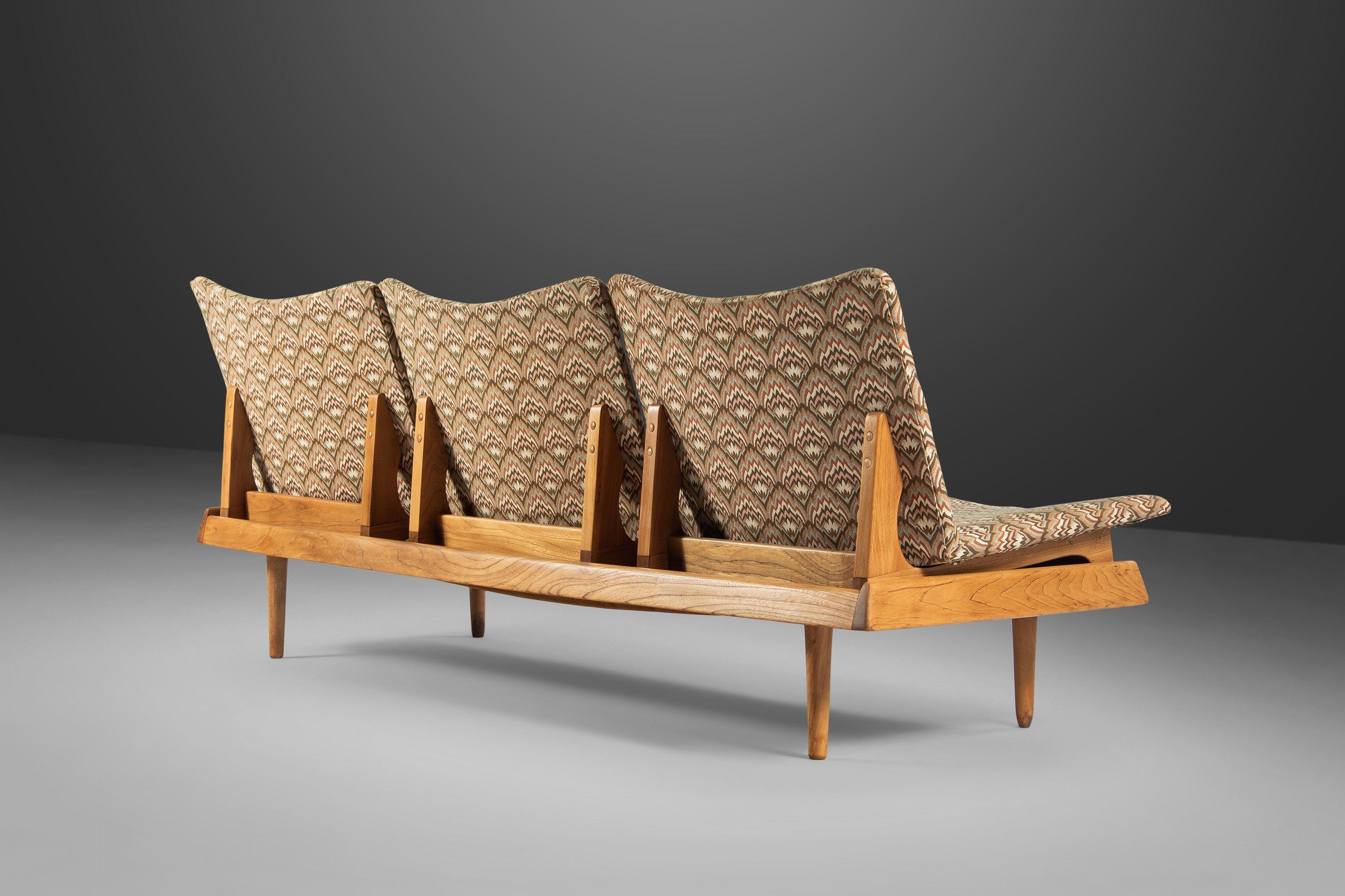Attention collectors! Often mistaken for the Model 161 bench by Hans Olsen (for Bramin, this exquisite modular seating group by Gerald McCabe in naturally stained walnut and original upholstery is as rare as it is visually striking. In 100%