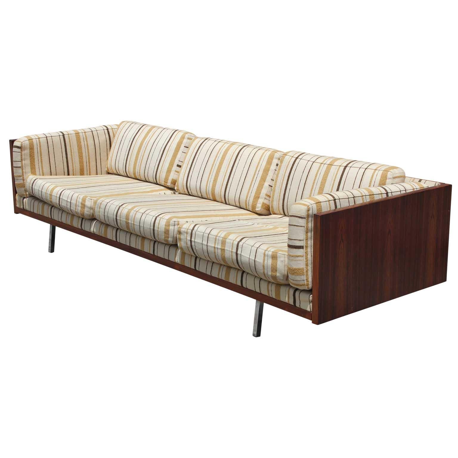 Rare and beautiful sofa by Komfort of Denmark. This is a case sofa or a clad box sofa. The frame is in rosewood with polished steel legs.