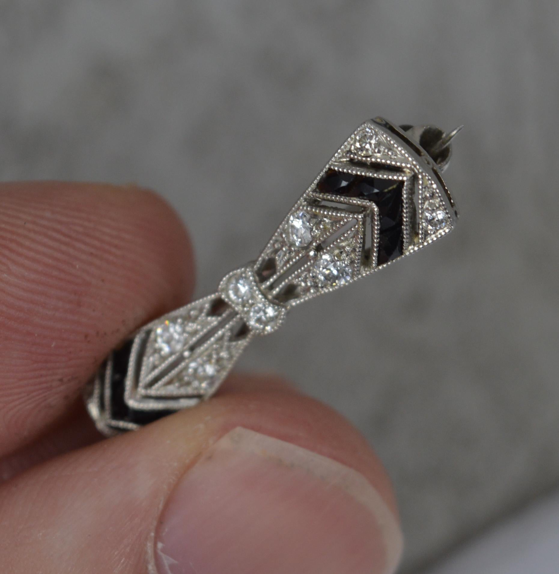 A fantastic Edwardian period piece by Tiffany and Co.

Solid platinum example throughout.

Set with ten natural diamonds, round cuts, with eight onyx stones of French cut.

Circa 1910 / 20.



Condition; Very good. Crisp design. Clean claws. Issue