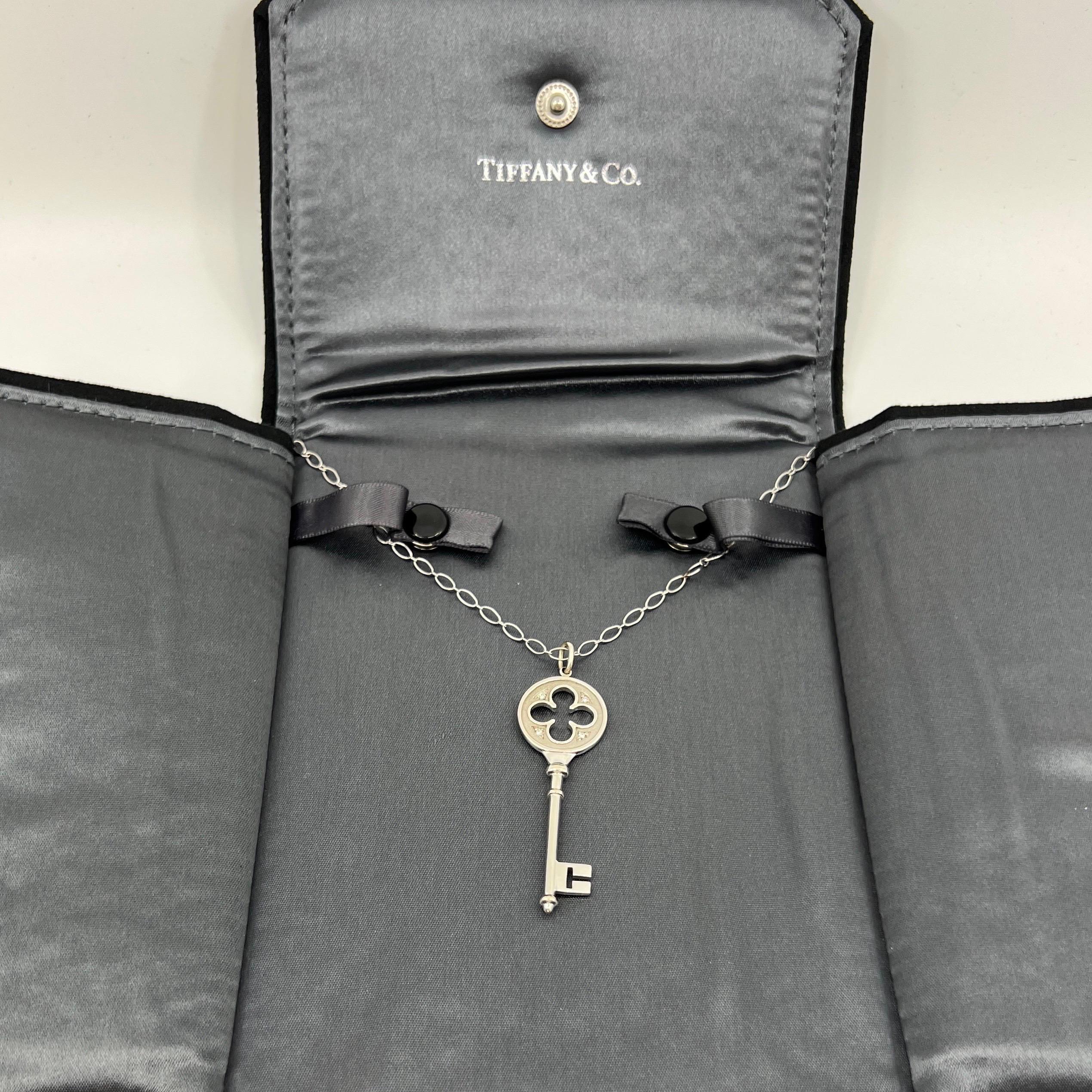 Tiffany & Co. 4 Leaf Clover Diamond 18k White Gold 2 Inch Key Pendant Necklace.

A beautiful and rare authentic Tiffany 4 leaf clover key pendant. Tiffany keys are 'radiant symbols of a bright future, representing brilliant beacons of optimism and