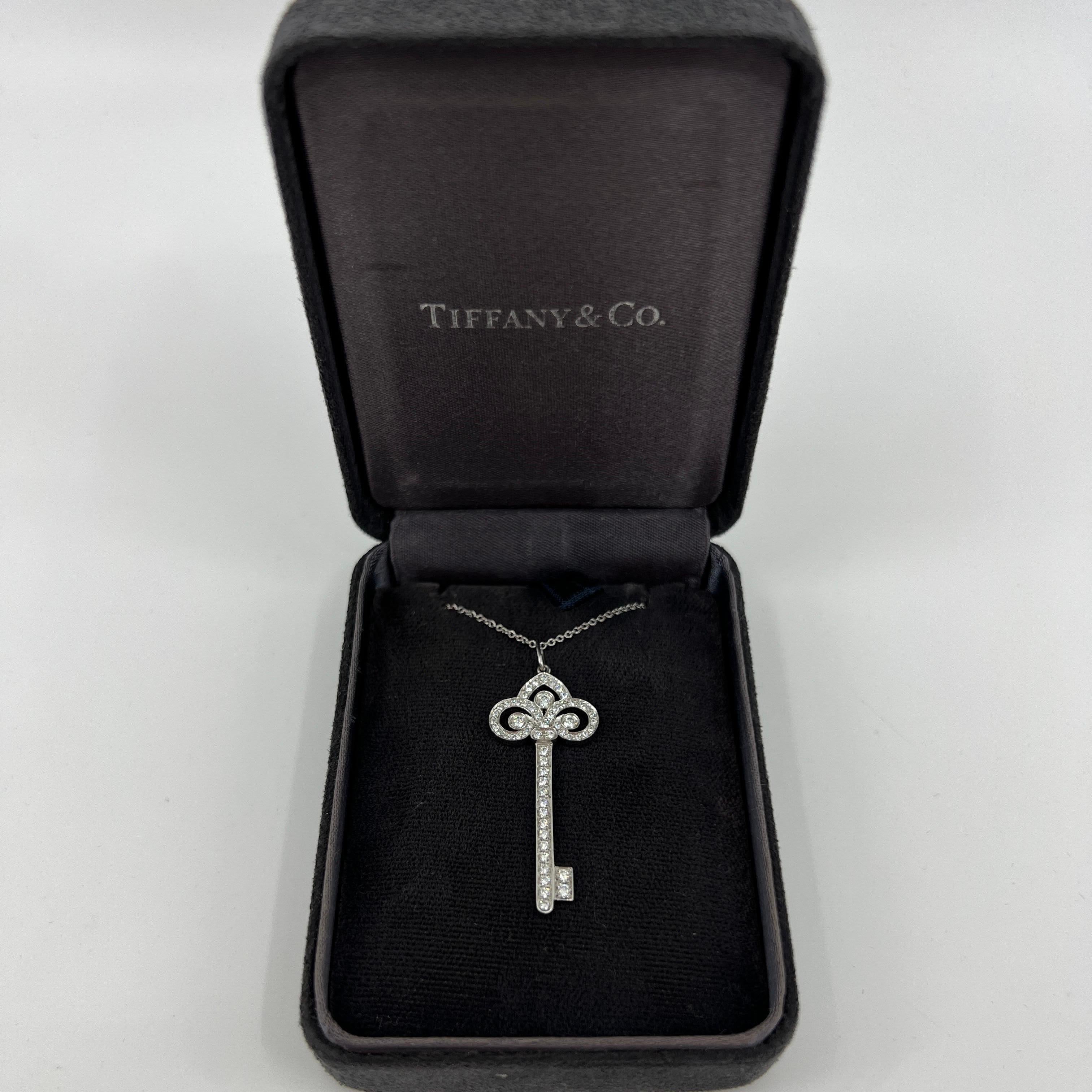 Tiffany & Co. 'Fleur de Lis' Diamond Platinum 1.5 Inch Key Pendant Necklace.

A beautiful and rare authentic Tiffany Key Pendant designed in the Fleur-De-Lis style. Tiffany keys are 'radiant symbols of a bright future, representing brilliant beacons