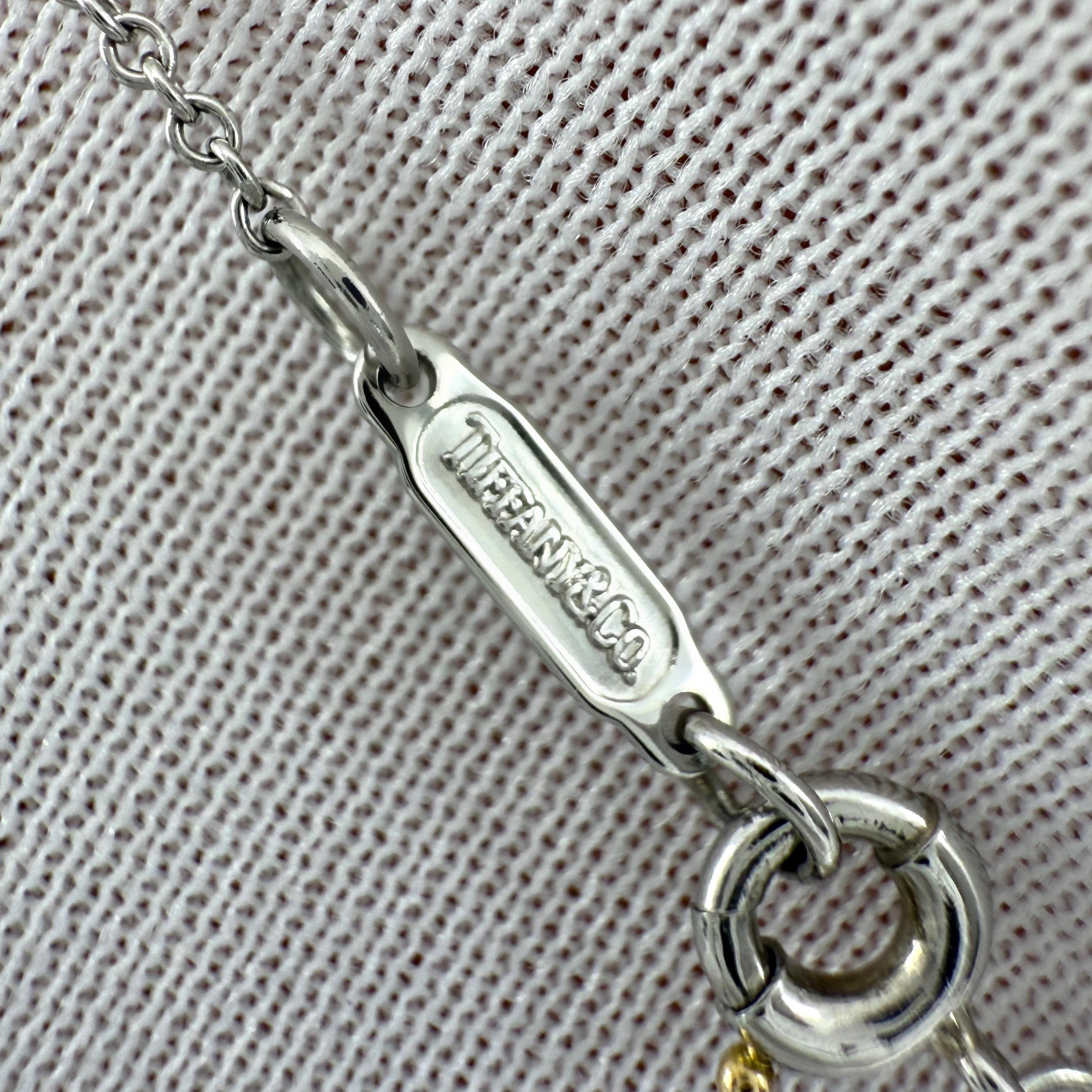 Rara Tiffany & Co. Collana con ciondolo a grappolo in oro 18k e platino con rubini e diamanti in vendita 1
