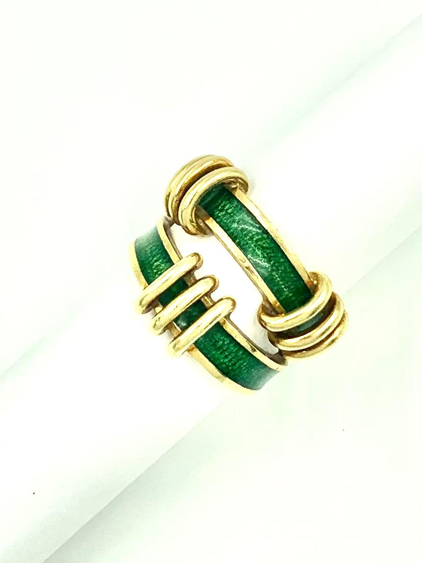 Rare large model vintage Jean Schlumberger for Tiffany & Co. two tiered knot motif cocktail ring in 18K yellow gold and emerald green enamel. The vibrant, striking design of this ring is an excellent complement to Schlumberger's Croisillon
