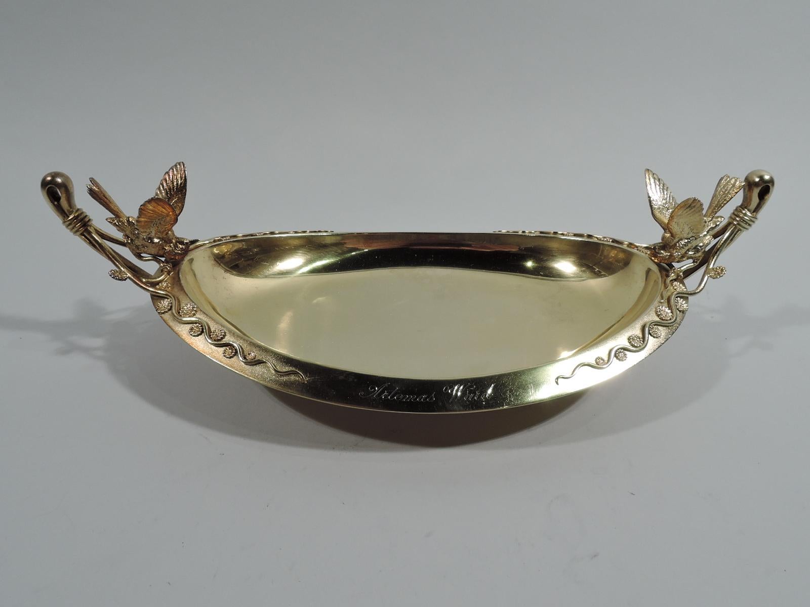 Rare Japanese sterling silver bowl. Made by Tiffany & Co. in New York. Oval well and turned-down rim. At ends are bird figures and handles comprising reed-wrapped loops with split mounts terminating in squiggly tendrils interspersed with applied