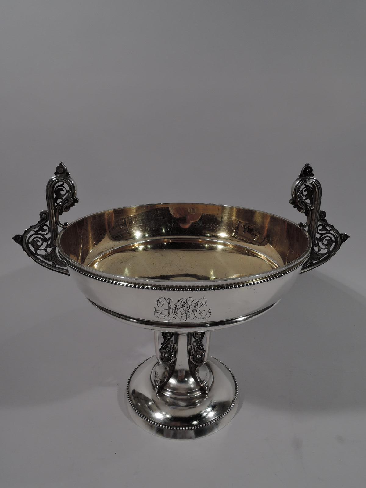 Rare Moresque sterling silver compote. Made by John C. Moore for Tiffany & Co. in New York. Greek kylix with round and flat bowl, knopped and tapering shaft, and double-domed base. Cast openwork brackets with mounted as side handles and to shaft.