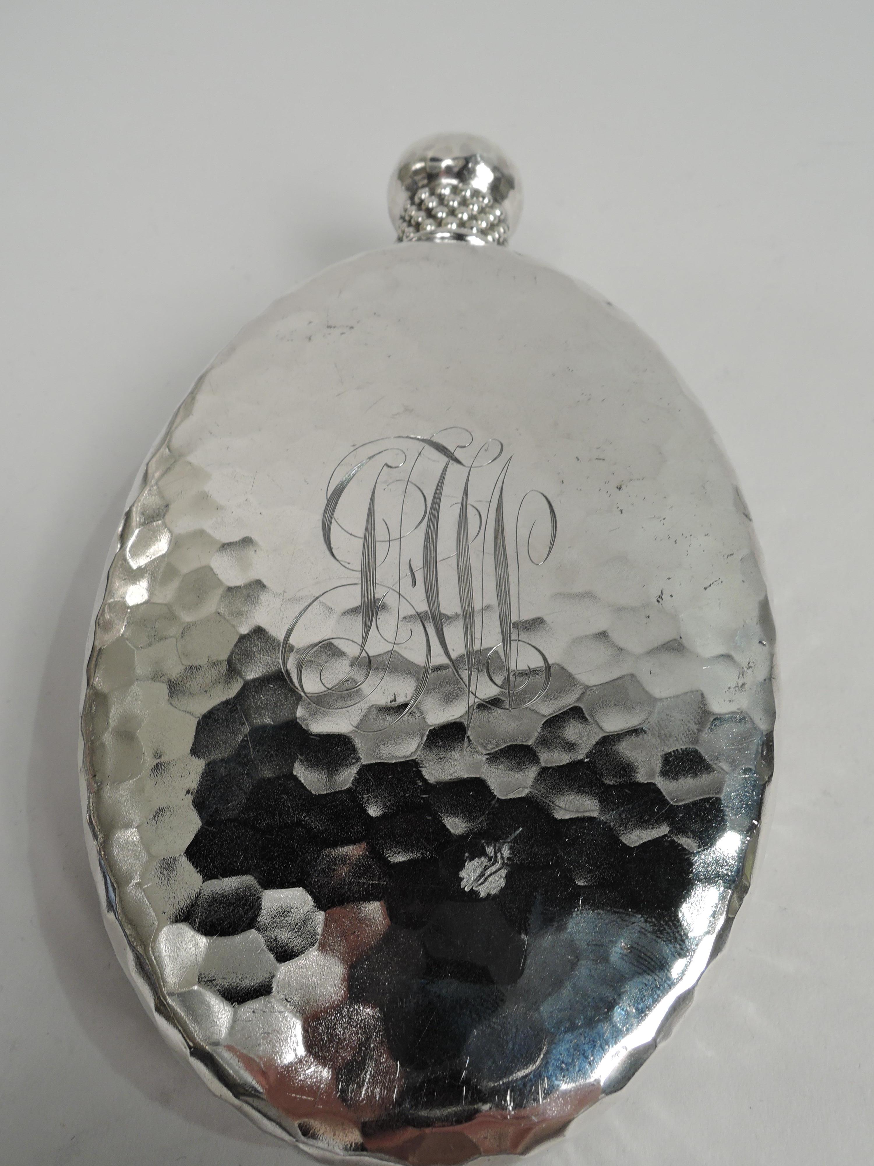 Rare sterling silver flask. Made by Tiffany & Co. in New York, ca 1882. Oval with curved sides and flat front and back. On front is seahorse with ribbed body and volute-scroll tail floating amongst seagrass. Back engraved with interlaced script