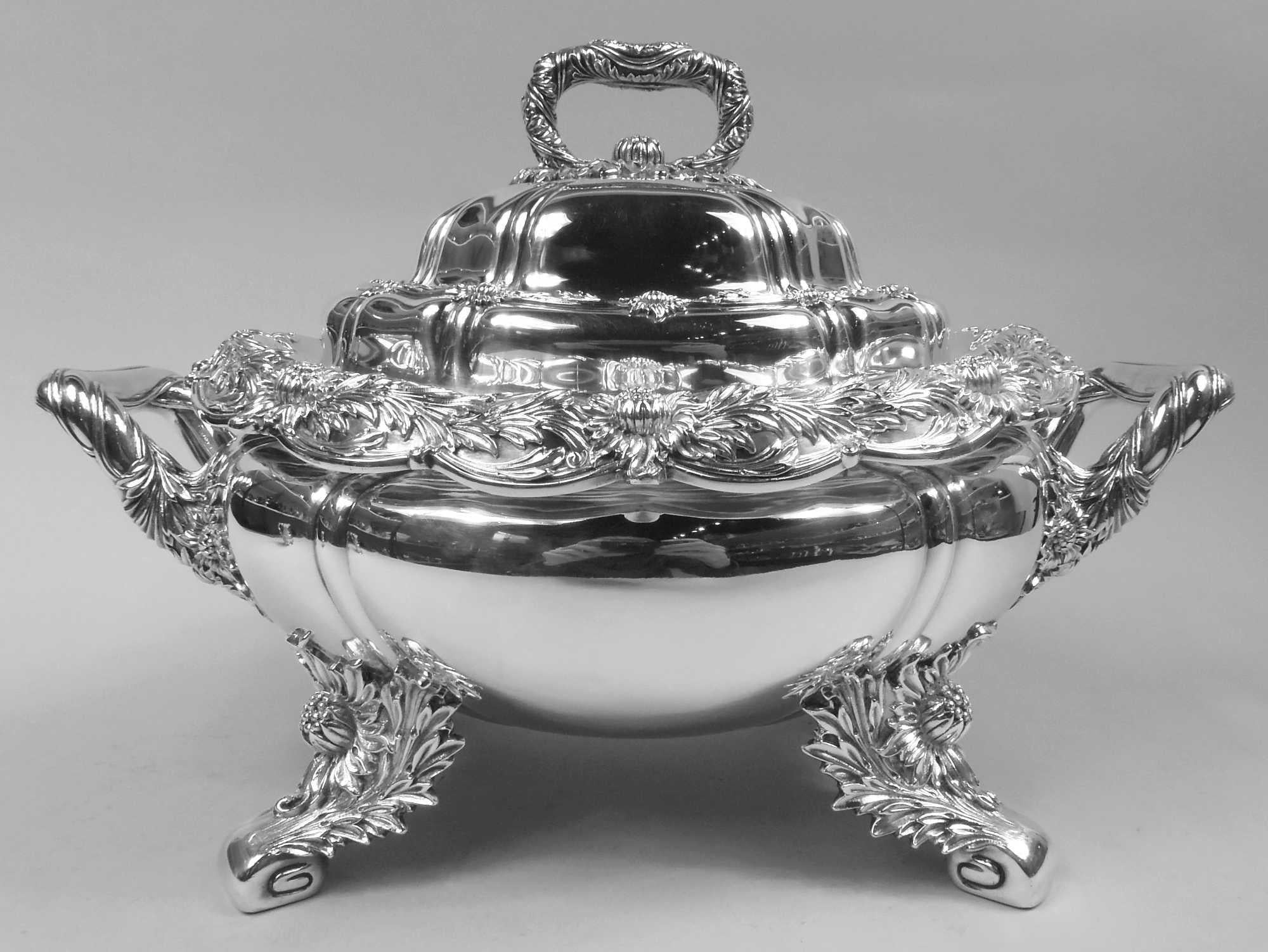 Rare Chrysanthemum sterling silver soup tureen. Made by Tiffany & Co. in New York. Lobed and oval bowl with scalloped and turned down scalloped rim. Bracket end handles and four splayed volute supports. Cover double domed with bracket finial. Dense