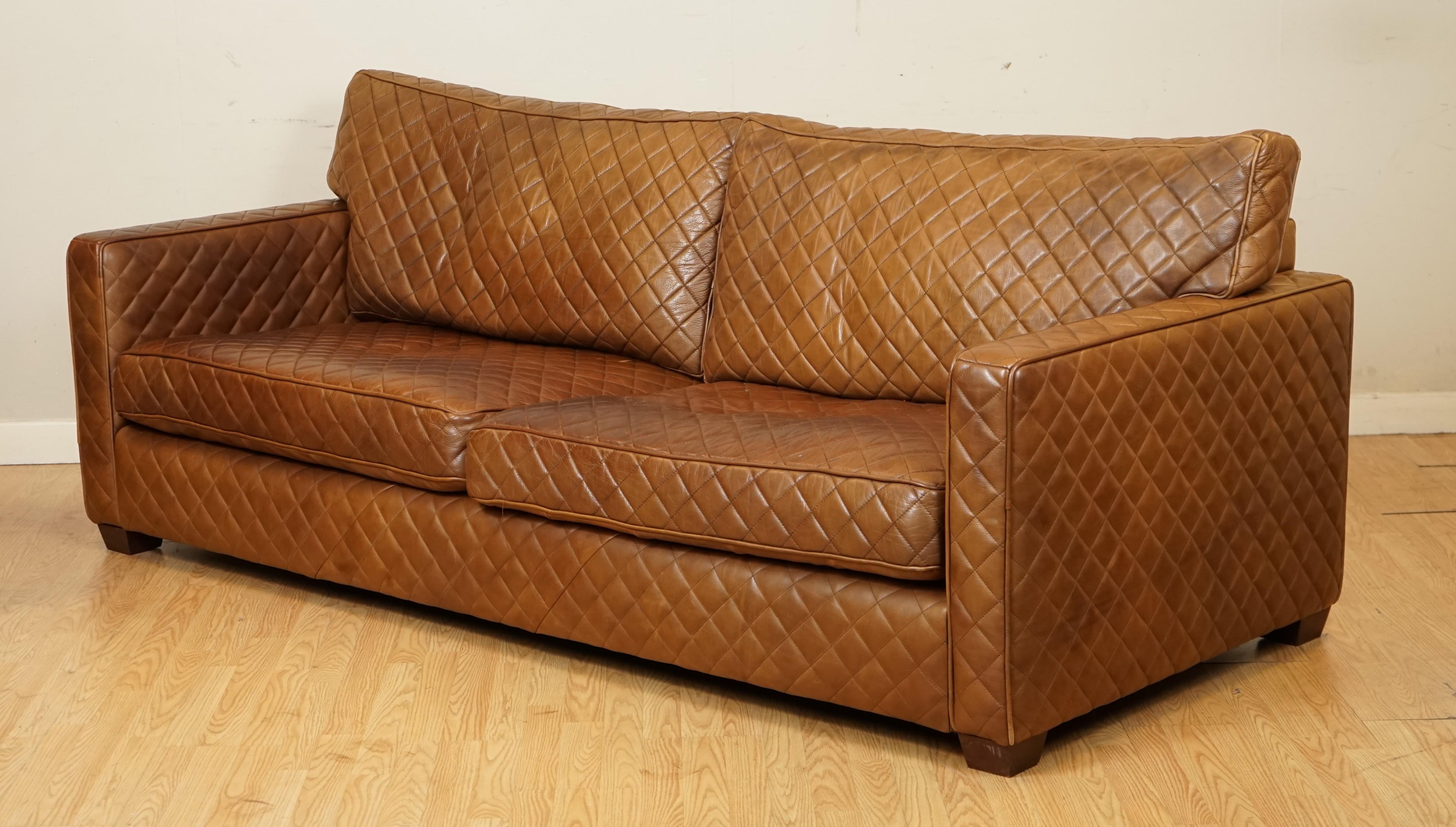 We are so excited to present to you this stunning Timothy Oulton sofa.
It can comfortably seat 3 people up to 4.

The diamond stitch design was only made to order, all the cushions are still nice and firm.

There will be some patina and general