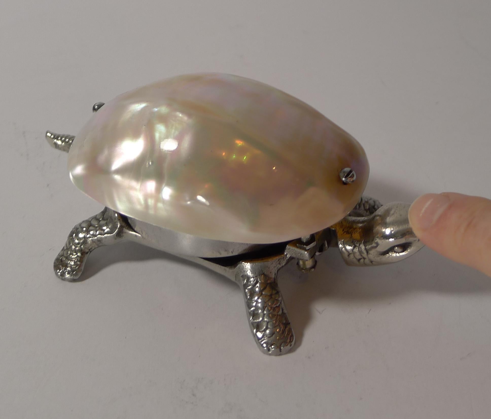 A fabulous and rare example of a novelty German mechanical bell made from a silver coloured metal in the form of the most charming tortoise.

The bell is would from the underside and rung by pressing either his head or tail, in full working