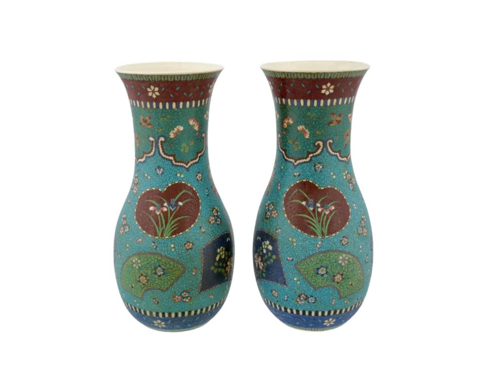 A pair of rare symmetrical large antique Japanese, Ming era, Totai porcelain vases. Each vase has a globular shaped body and a fluted mouth. The exteriors of the wares are covered with polychrome enamel figural medallions with flowers and