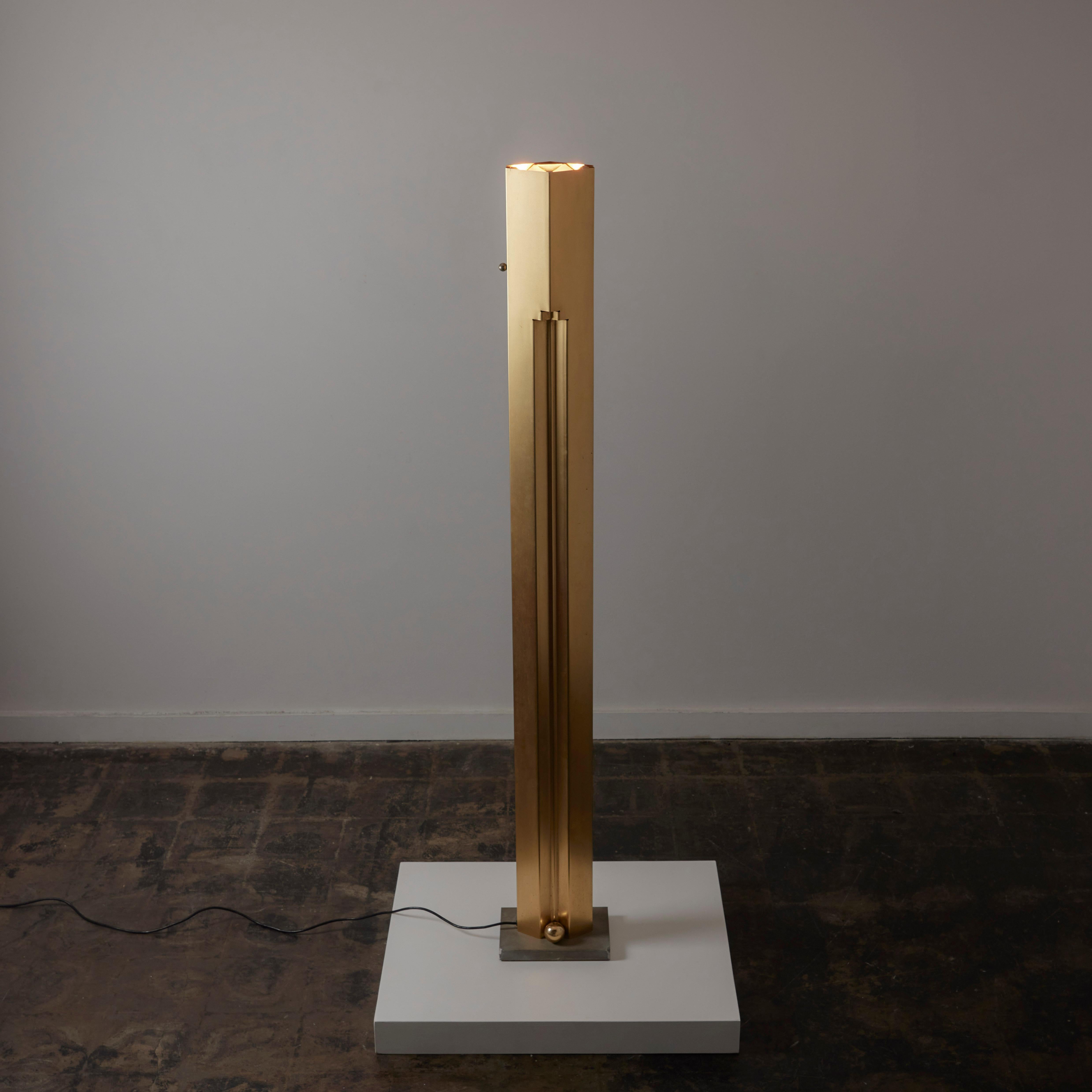 Rare 'Totem' Floor lamp by Kazuhide Takahama for Sirrah Designed and manufactured in Italy, in 1982. A monolithic brass floor lamp with typographical trim detailing running along the length of the piece. Brass ball finials are added at the bottom