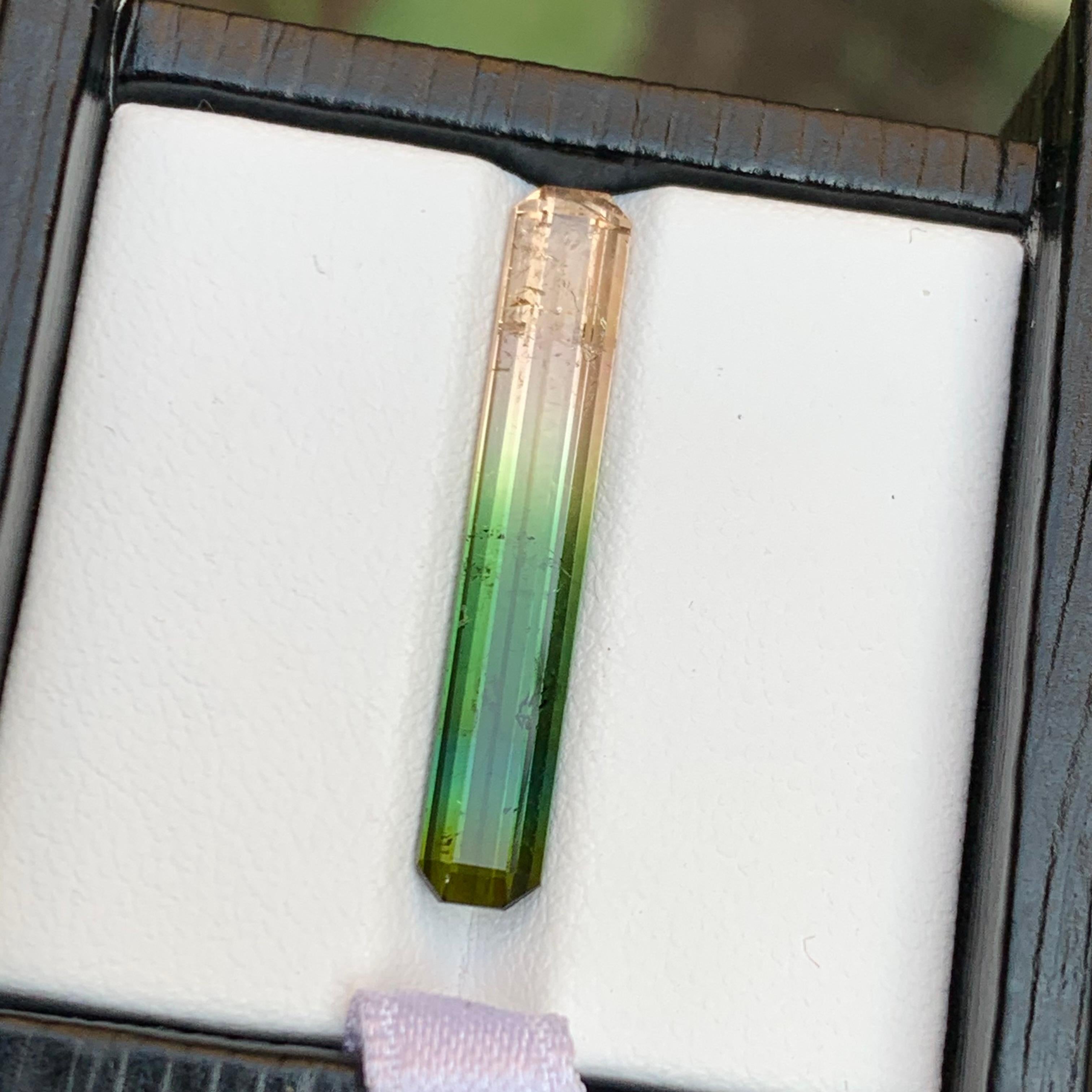 Gorgeous Tricolor Watermelon Natural Tourmaline Loose Gemstone! Meticulously crafted in an elongated emerald cut, this exquisite gem promises to captivate with its vibrant hues. 
Ideal for adorning a distinguished lady or gentleman, it's a testament