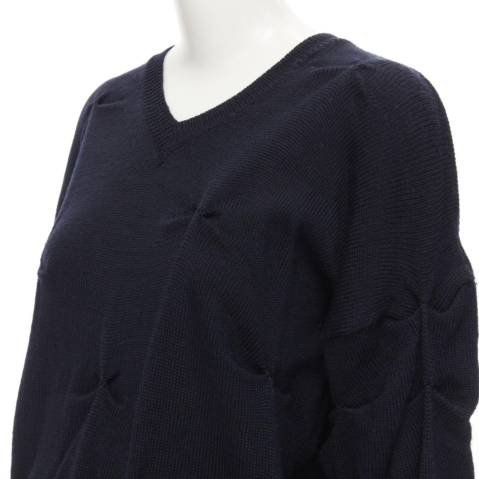 rare TRICOT COMME DES GARCONS Vintage 1980's black wool pinched bow sweater
Reference: CRTI/A00739
Brand: Comme Des Garcons
Designer: Rei Kawakubo
Collection: 1980s
Material: 100% Wool
Color: Black
Pattern: Solid
Closure: Pullover
Extra Details: