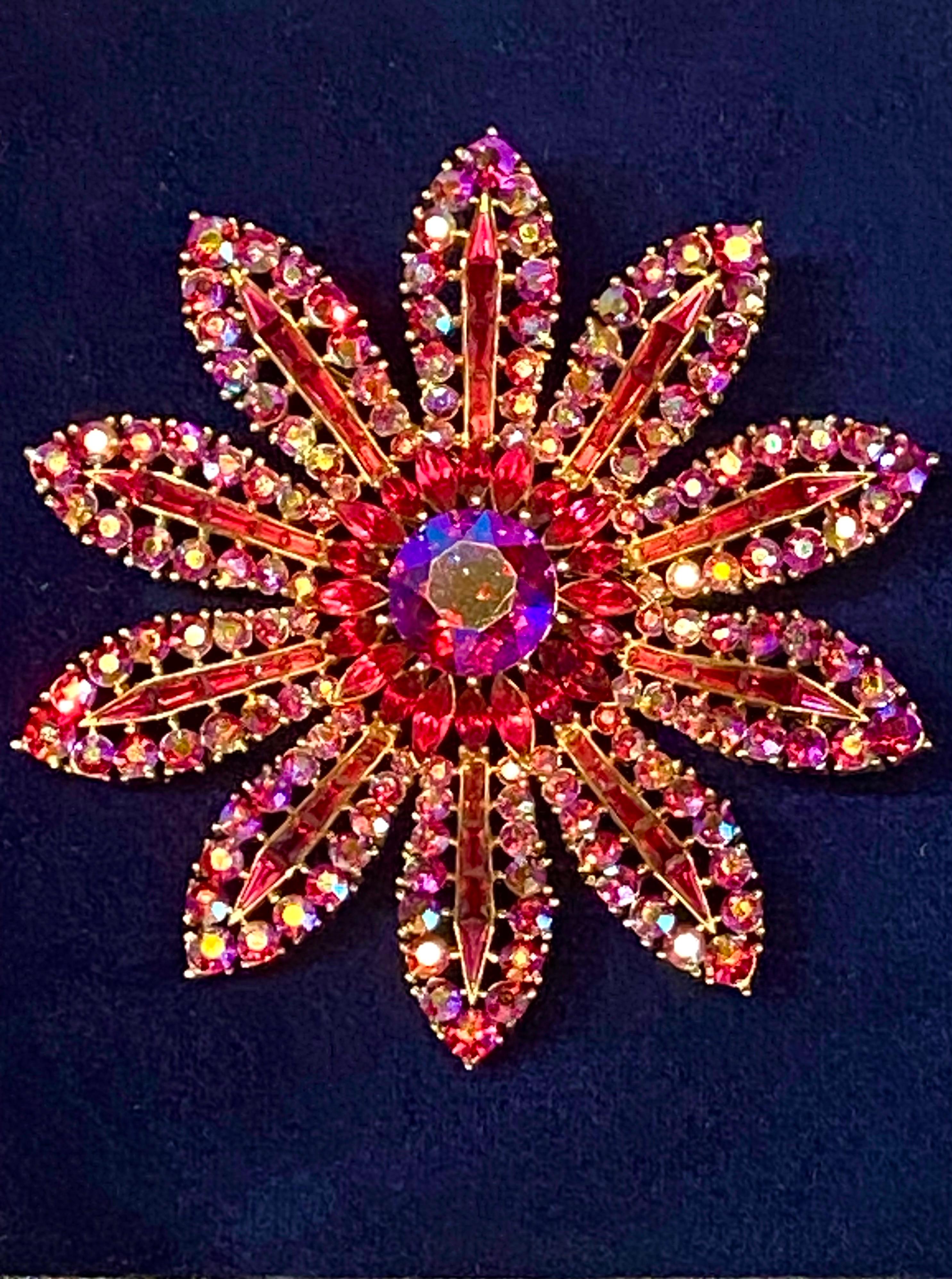This Trifari pin is a stunning piece dating from the mid 1950s. It has the crown Trifari mark with c in a circle copyright mark dating seen on pieces from 1955 to 1969. This 3.25 inch diameter large margarita flower is a rare Trifari design not