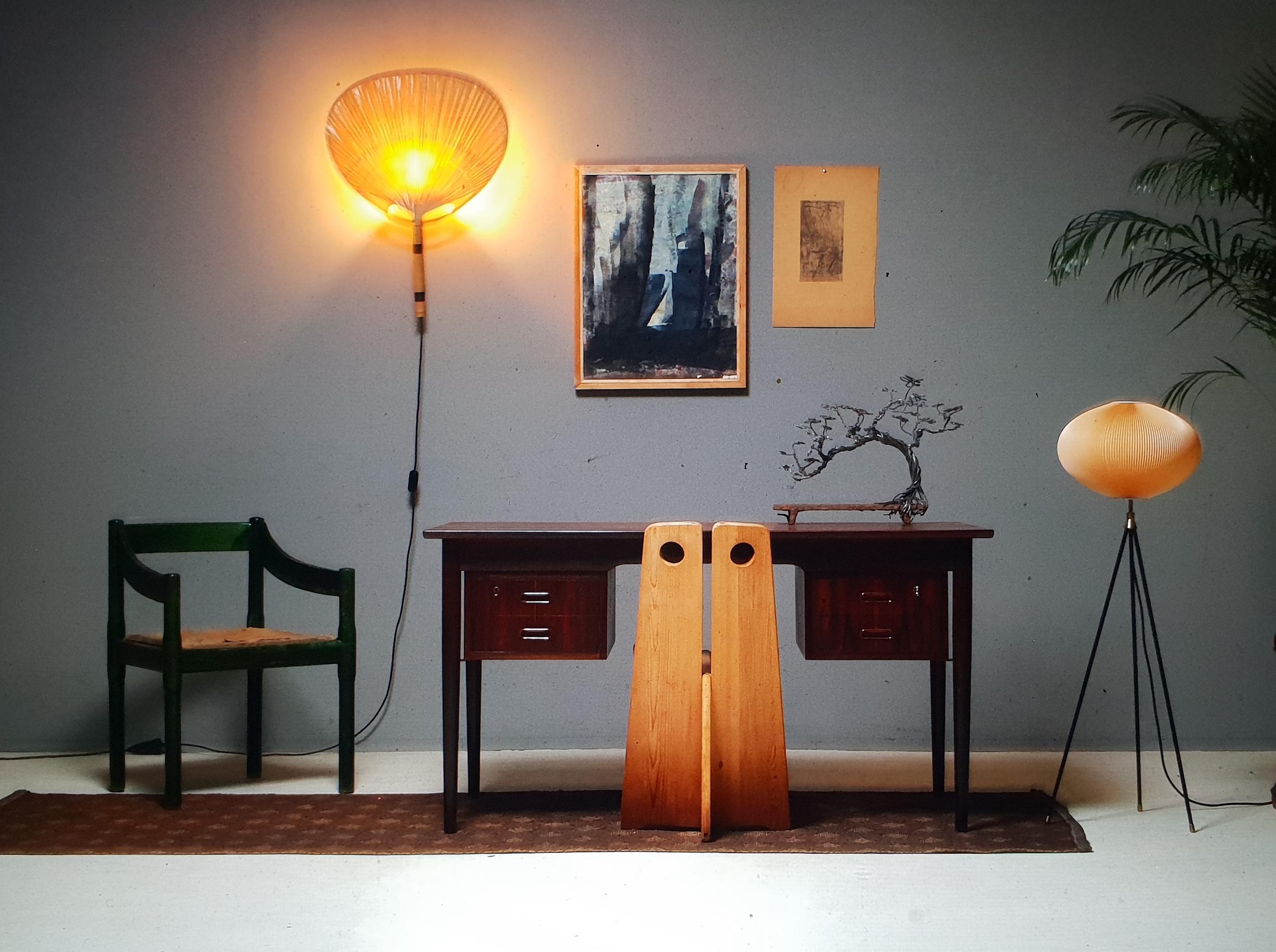 A rare tripod floor lamp produced by the German lighting company Aro Leuchte.
This floor lamp is from the late 1950s-early 1960s.
The tripod is made out of black lacquered steel and does have beautiful brass elements.
The shade is made from hand