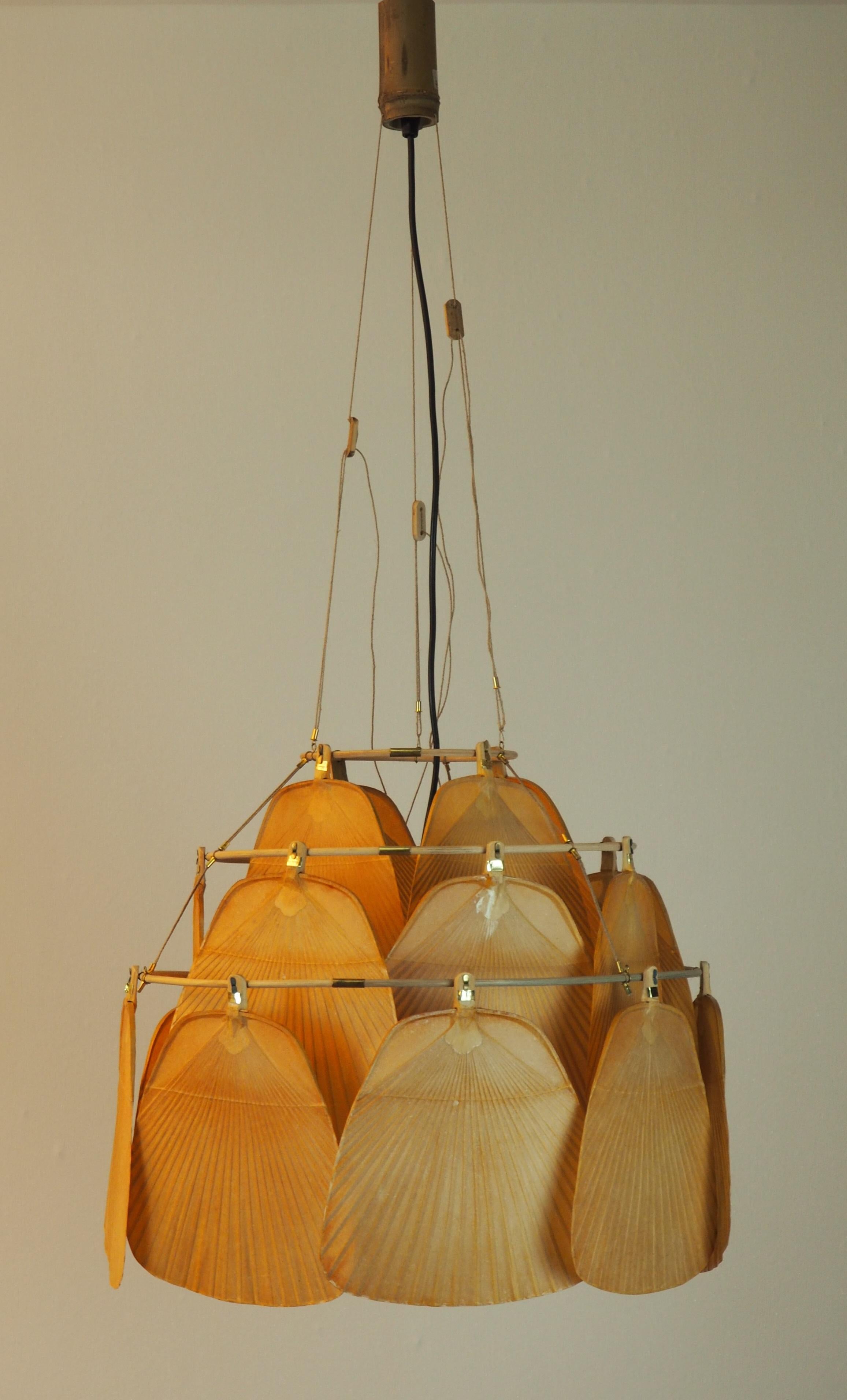 Exceptional Uchiwa bamboo fan chandelier or pendant lamp by Ingo Maurer for Design M, 1970s, Germany. Executed in bamboo and 19 rice paper fans.
Socket: 1 x E27 Edison for standard screw bulbs.
Height adjustable by suspension from 3 strings.
The