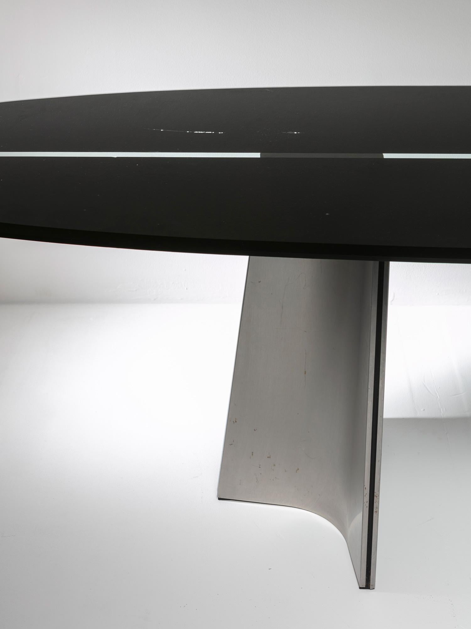 Remarkable Ufo table by Luigi Saccardo for Arrmet.
Large glass surfboard shaped top with black serigraphy and aluminum feet.