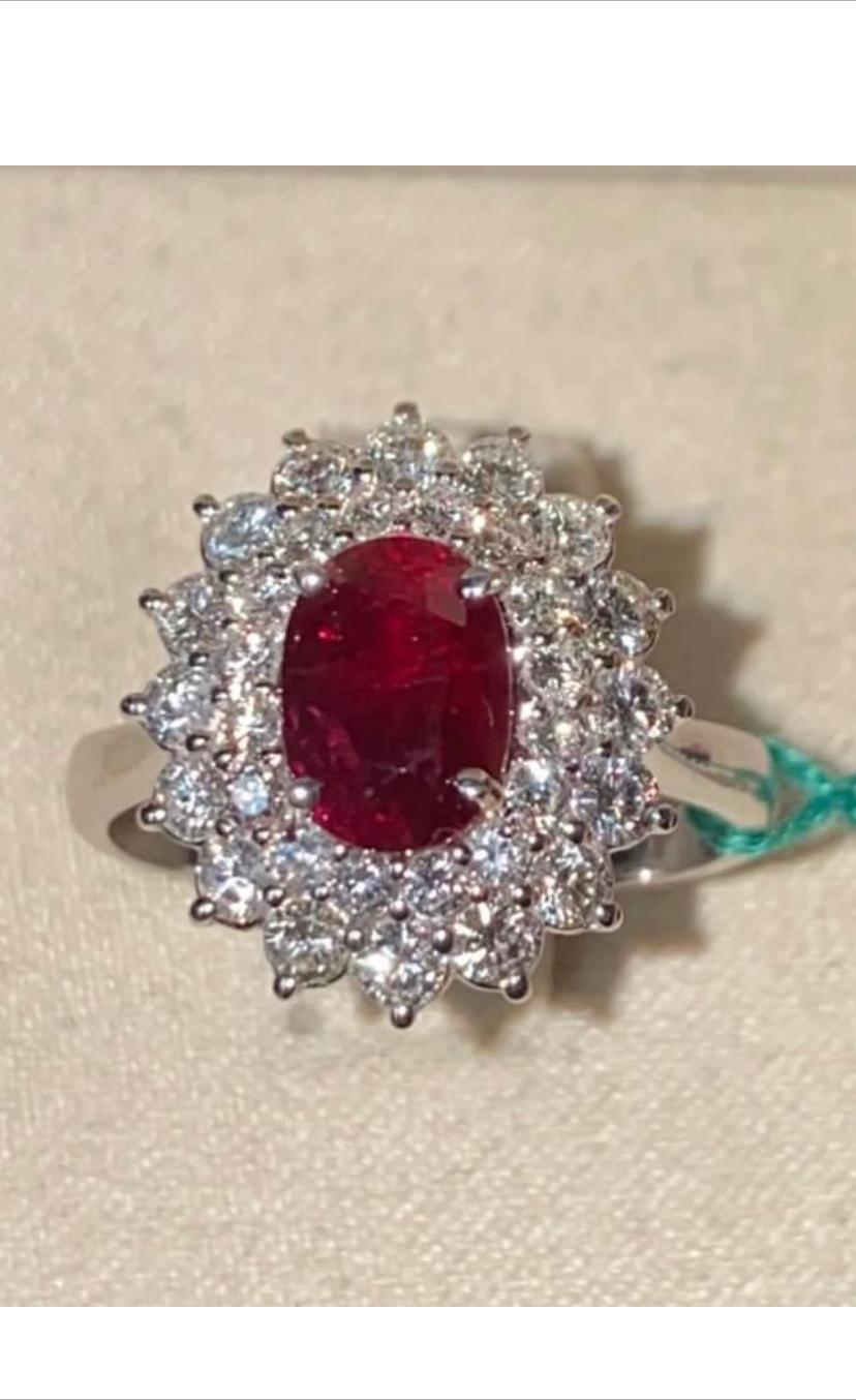 Rare unheated ruby Pigeon Blood 2,12 ct and round brilliant cut diamonds 1,07 G/VS , on 18k gold ring .
 Handcrafted fine Jewels by artisan goldsmith.
Excellent manufacture and quality.

Complete with AIGS report.
