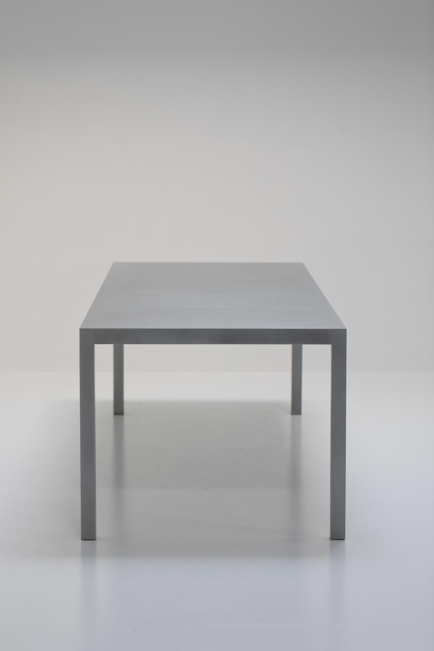 A uniquely sized design classic, this T88A table was designed by Maarten van Severen in 1988 and produced by Lensvelt Netherlands circa 2000 as a special private commission.  

Suitable as a work or dining table that fits up to 8-10 guests, it is