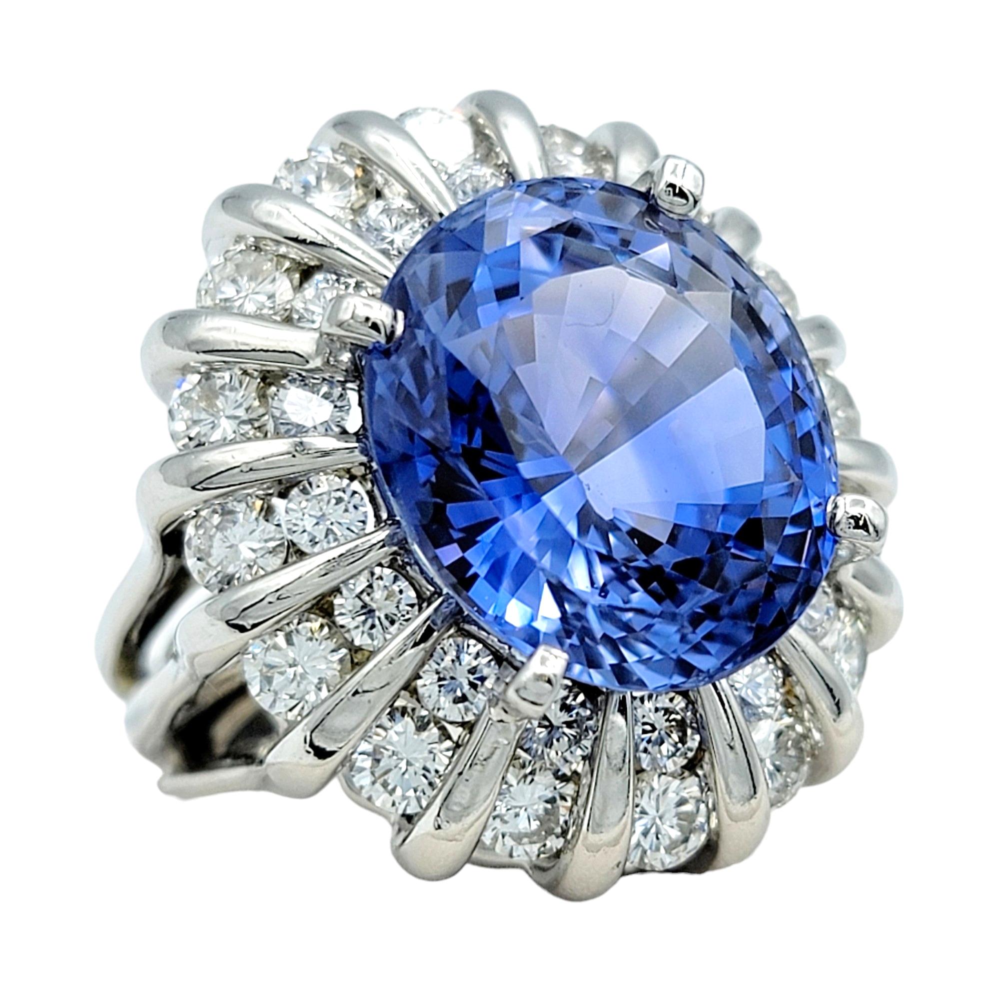 Introducing the epitome of luxury and sophistication, our breathtaking natural Ceylon sapphire and diamond cocktail ring is a true masterpiece. The focal point of this extraordinary piece is a mesmerizing 16.27-carat oval cut Ceylon sapphire,