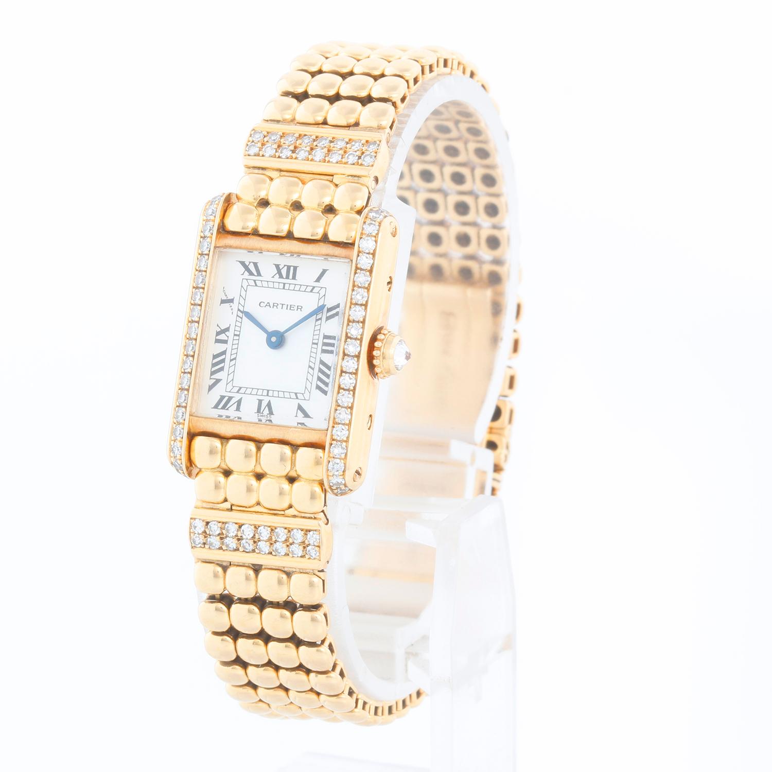 Rare & Unusual Cartier 18K Yellow Gold Tank Ladies Watch 8057 - Quartz. Factory 18K yellow gold with pave  diamond case ( 18 x 25mm ). Silver tone dial with black roman numerals. Ball link style bracelet with double row bar of diamonds across each