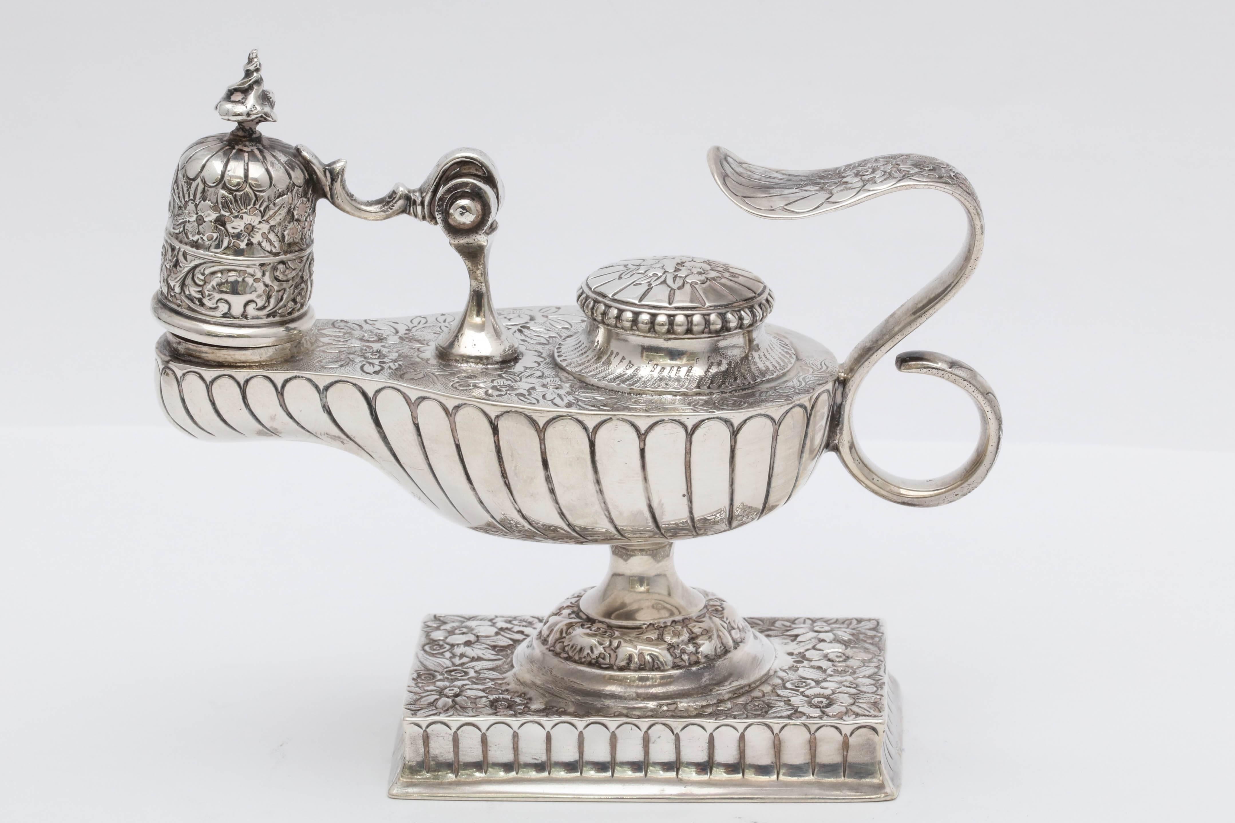 Rare and unusual, Edwardian, sterling silver, Aladdin's oil lamp - form table lighter, Chester, England, 1904, George Nathan and Ridley Hayes - makers. Lovely design; rectangular base. Hinged snuffer. Measures 4 1/2 inches wide (from tip of snuffer