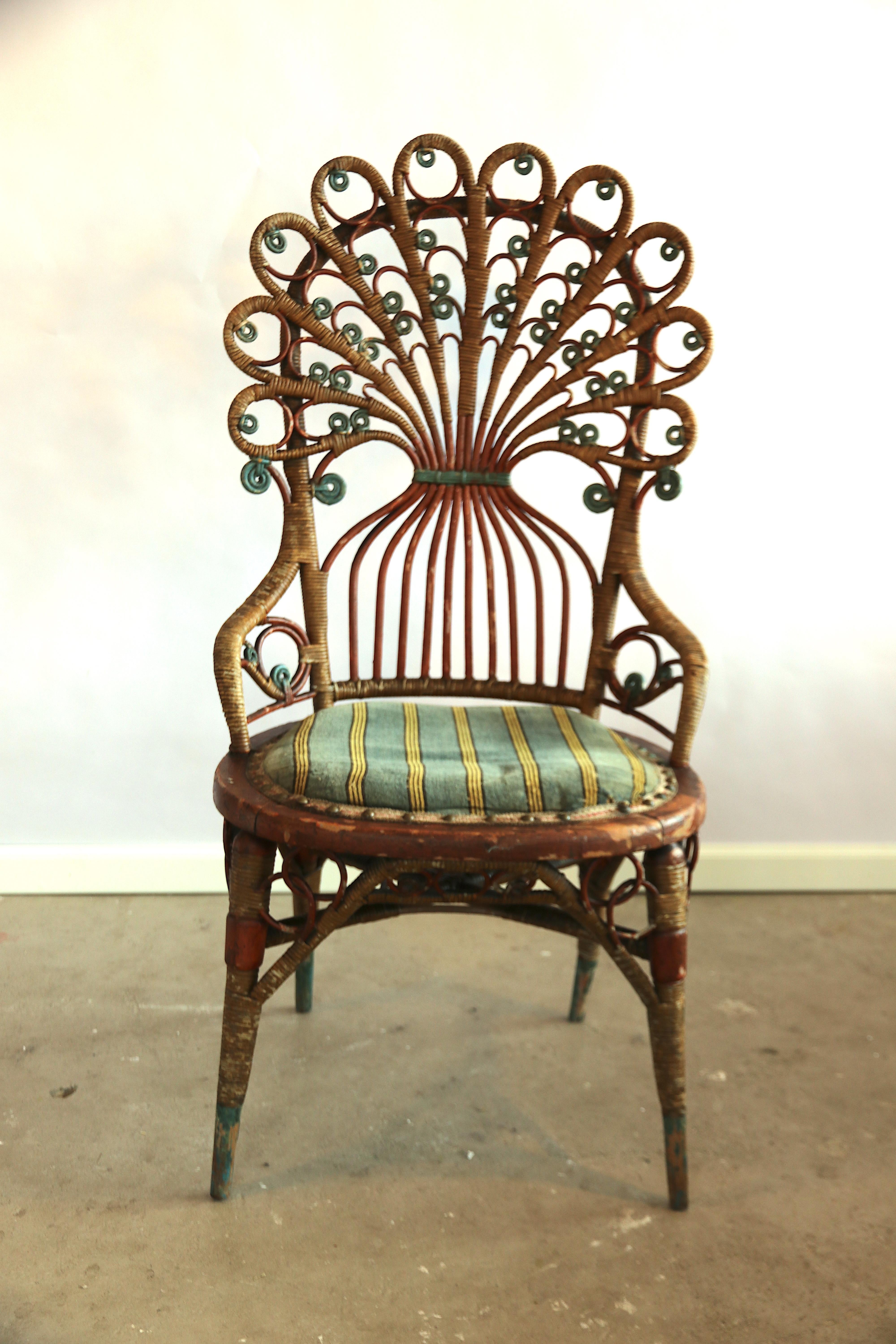 Amazing semi armchair in the shape of a peacock tail from the beginning of the 20th century. This is a very rare art-nouveau époque antique chair; which regarding the age is in an amazing condition with an equally amazing patina according to the age