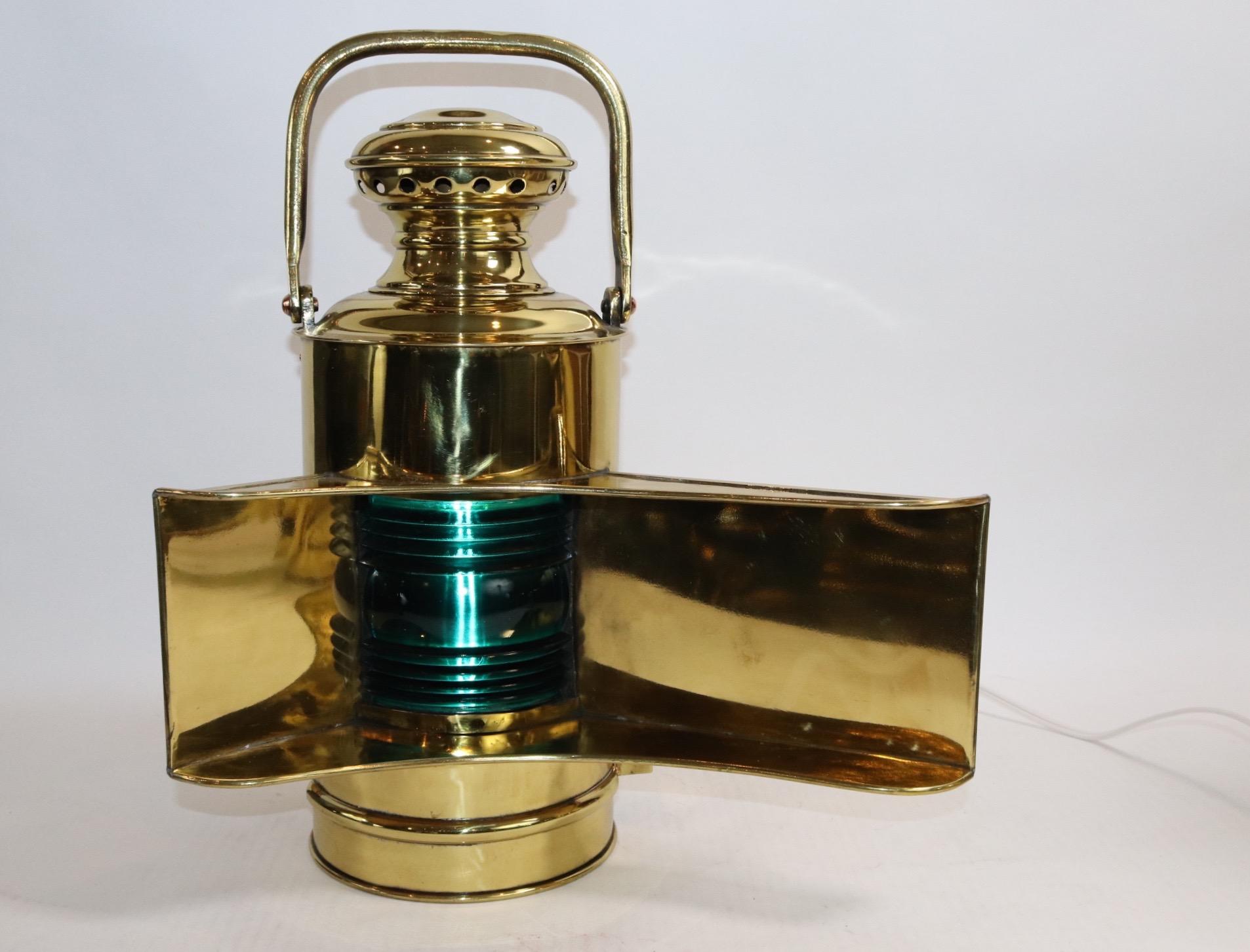 Rare pair of World War One battleship port and starboard ship lanterns with wide bezels, fresnel glass lenses, carry handles, hinged doors. Both have been meticulously polished and lacquered. The lanterns have been wired for home display. Weight is