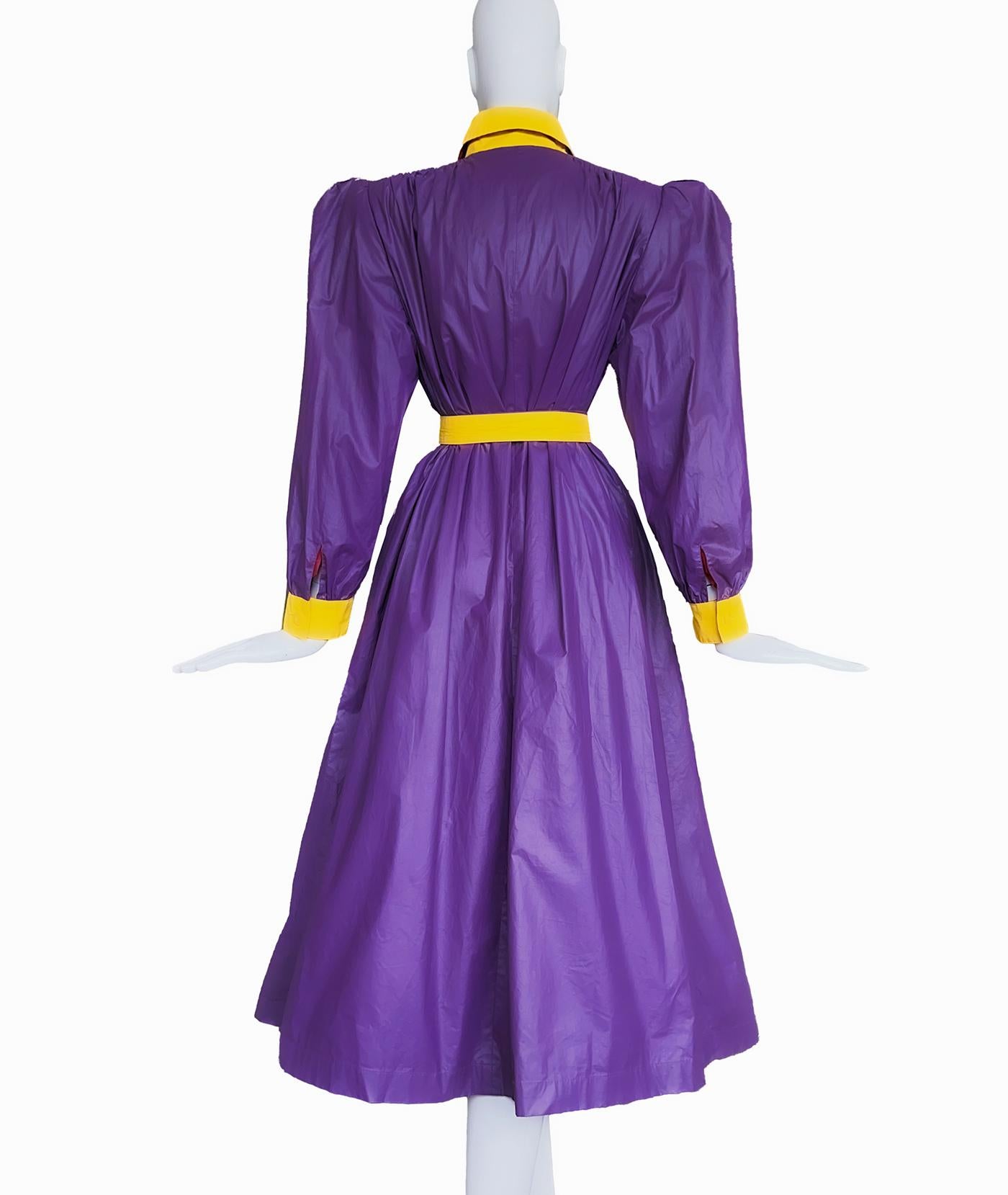 Stunning Valentino Raincoat. Love these colours! Purple/violet and yellow, definitely Gucci vibes, a super rare and extraordinairy piece. 
Puff Shoulders, yellow collar and cuffs. Closes with hidden buttons. 
Rare vintage piece, assuming late 80s.-