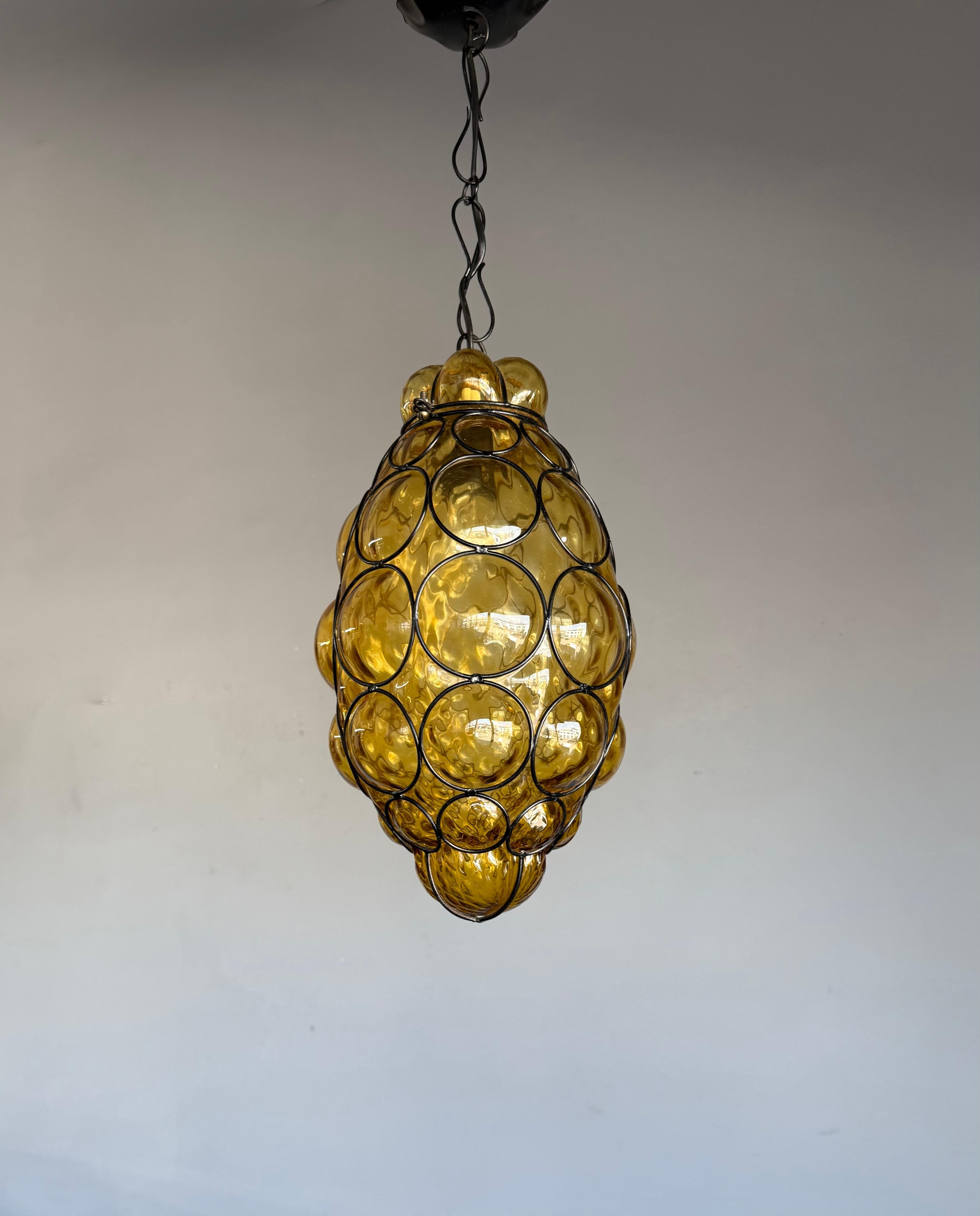 Beautiful color and practical size Italian fixture with mouth blown glass in a metal frame.

If you are looking for a rare and stylish shape fixture to grace your home then this handmade antique specimen could be coming your way soon. With 20th