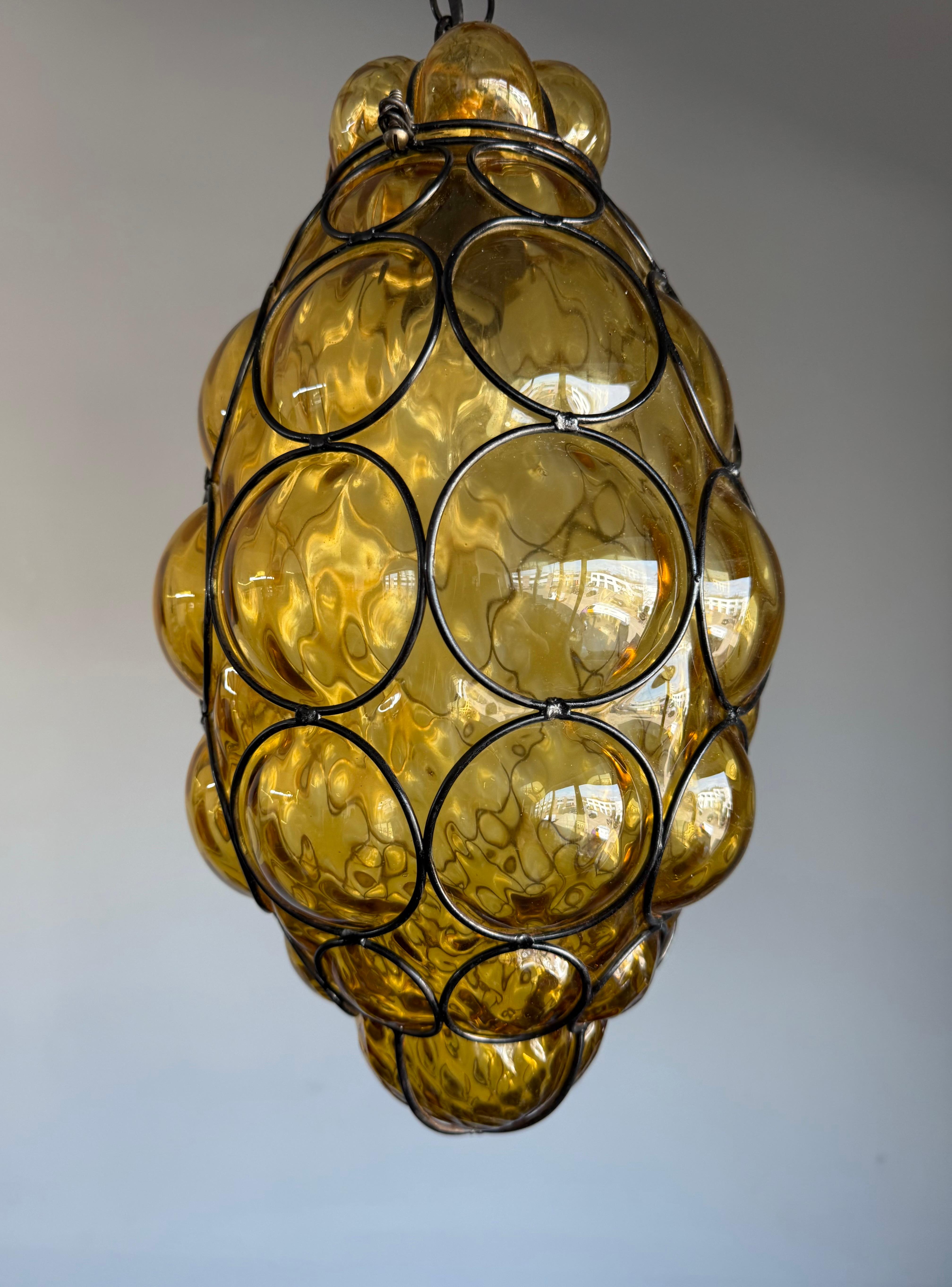 Mid-Century Modern Rare Venetian Murano Pendant Light with Mouth Blown Amber Colored Glass in Frame For Sale