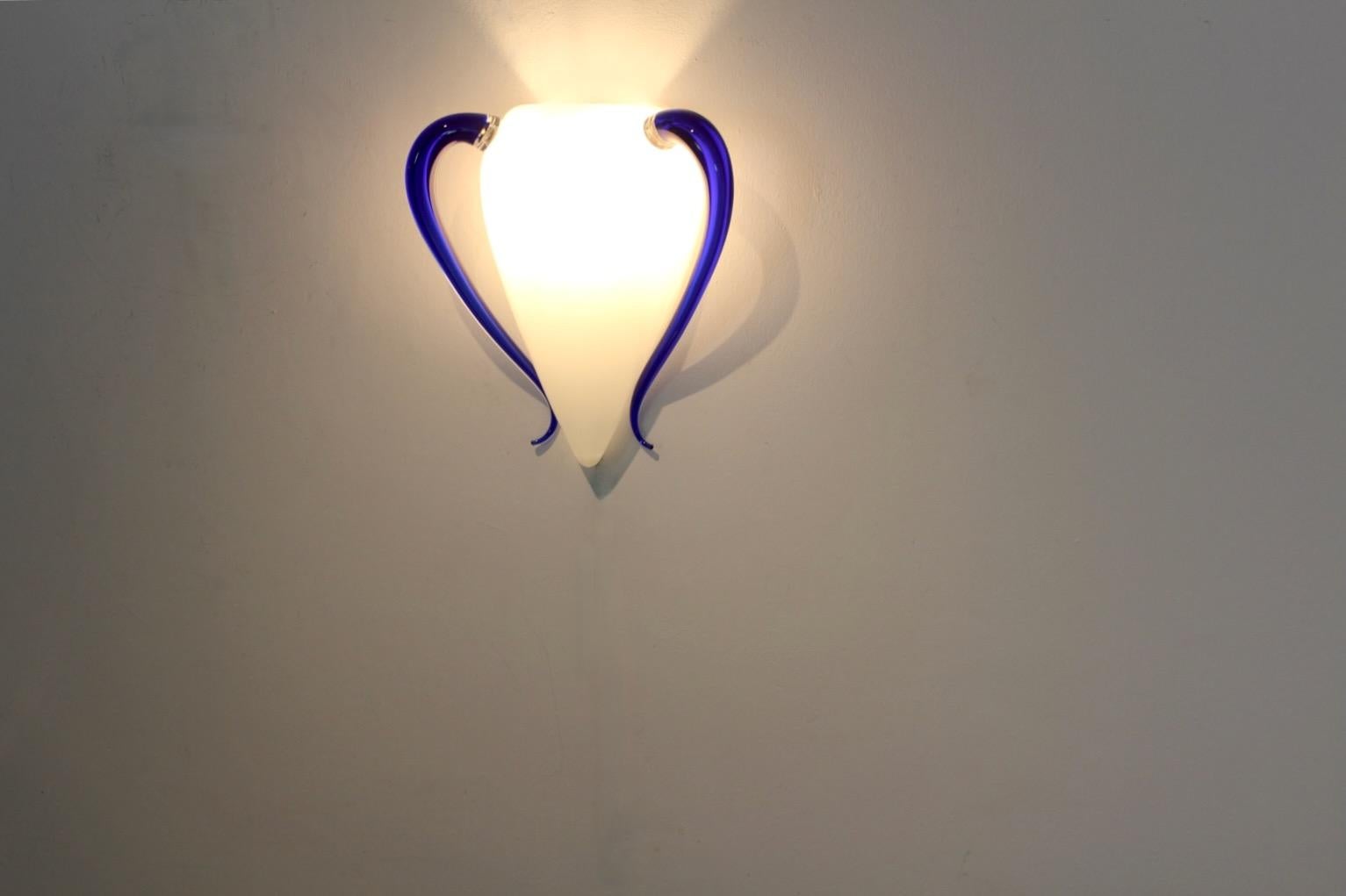 Very rare and highly sophisticated hand-blown Murano Glass Wall Sconce produced in Italy by Barovier & Toso in the early ‘90’s. The lamps are designed by Marco Mencacci in 1993. The name of the lamp is called ‘Venexiana’. 

The lamp comes with a