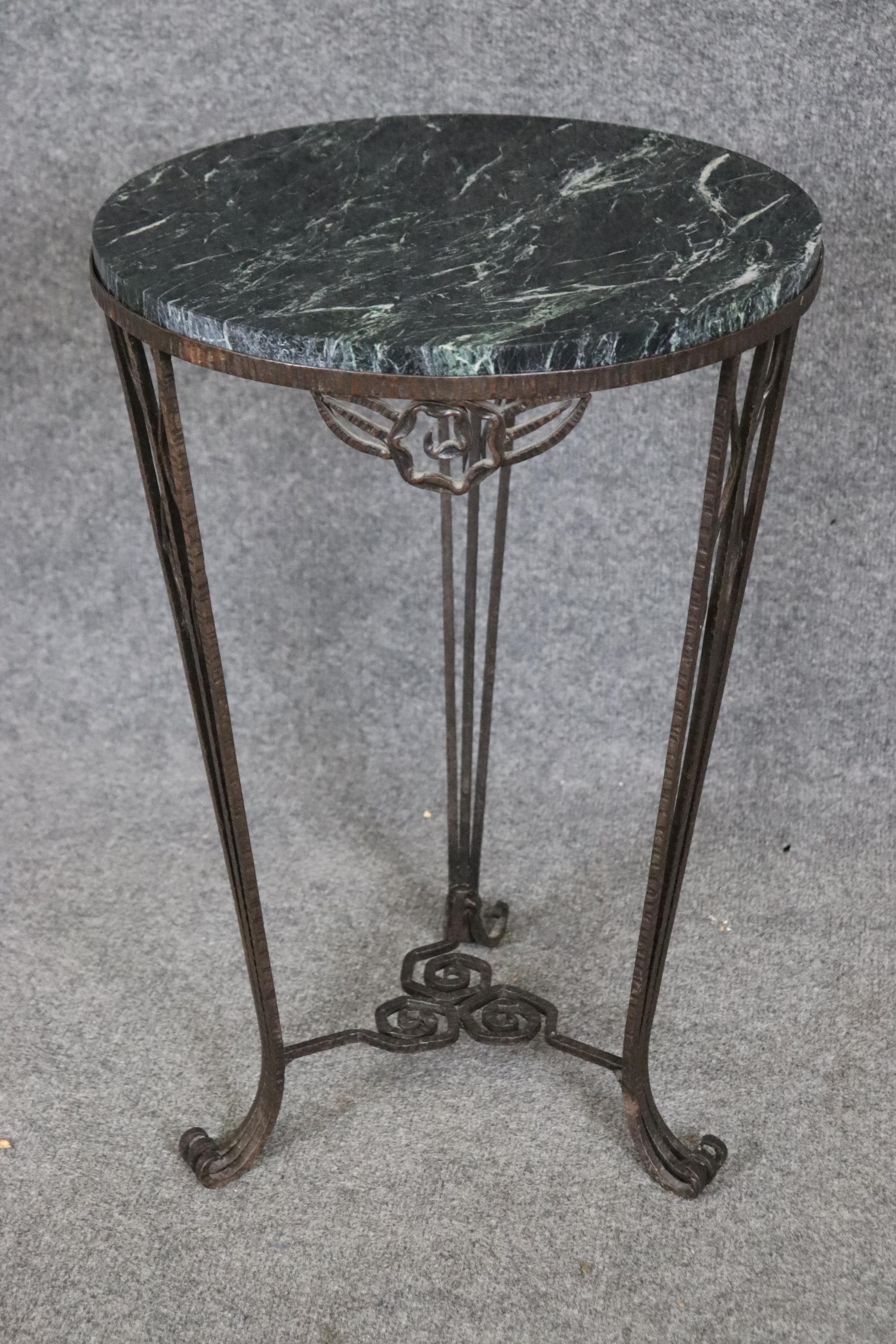 This is a superb Fer Forge style Oscar Back attributed table. The table and marble are in very good condition. Measures 16 x 16 wide x 23.5 tall. The table features a gorgeous wrought iron frame and great green Verdi marble top. Dates to the 1920s
