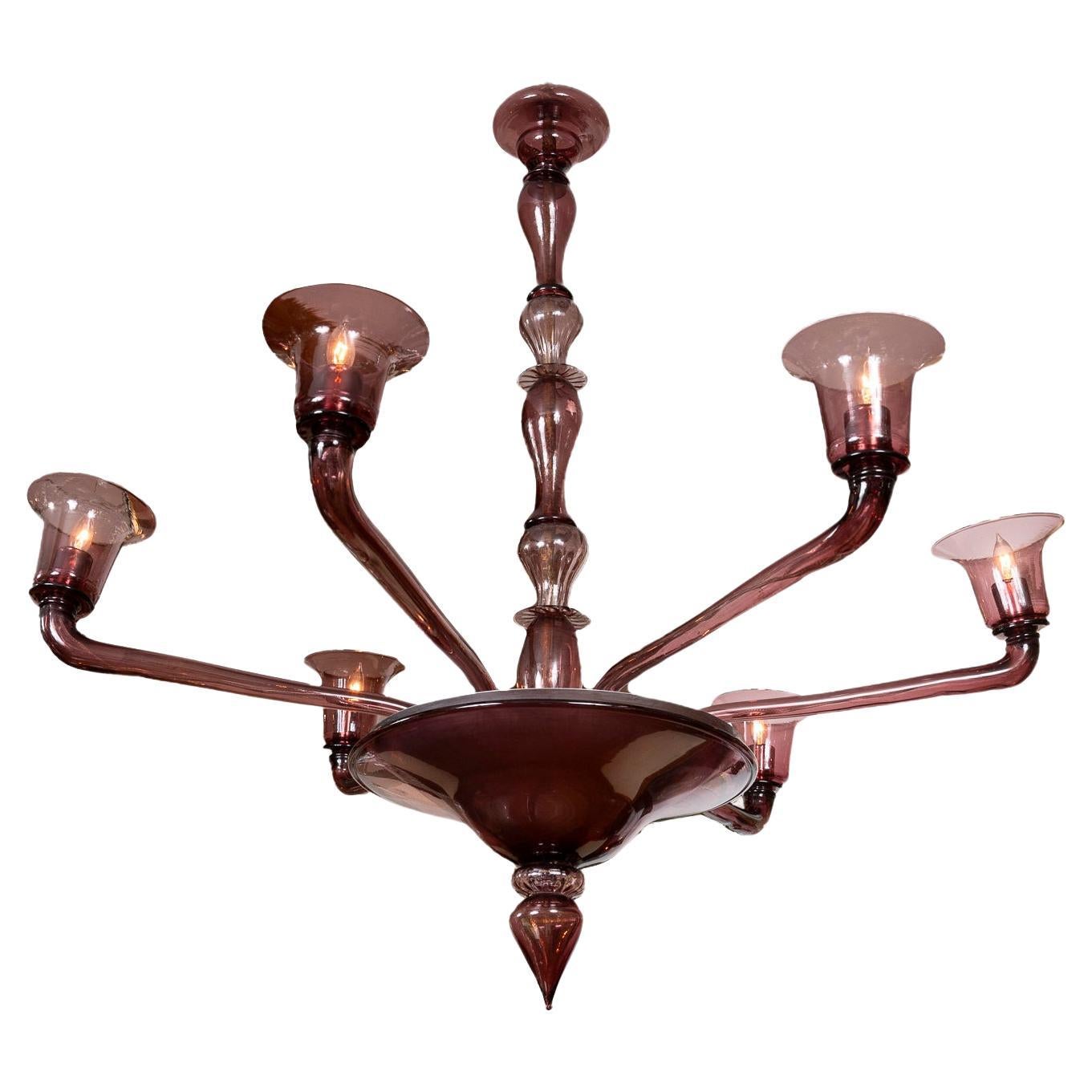 A rare and large Veronese Six Arm Up-light Chandelier blown in a beautiful shade of plum. This sleek and timeless fixture with a center shaft comprised of six separate pieces of shades of plum displays six outreaching straight arms upholding deep