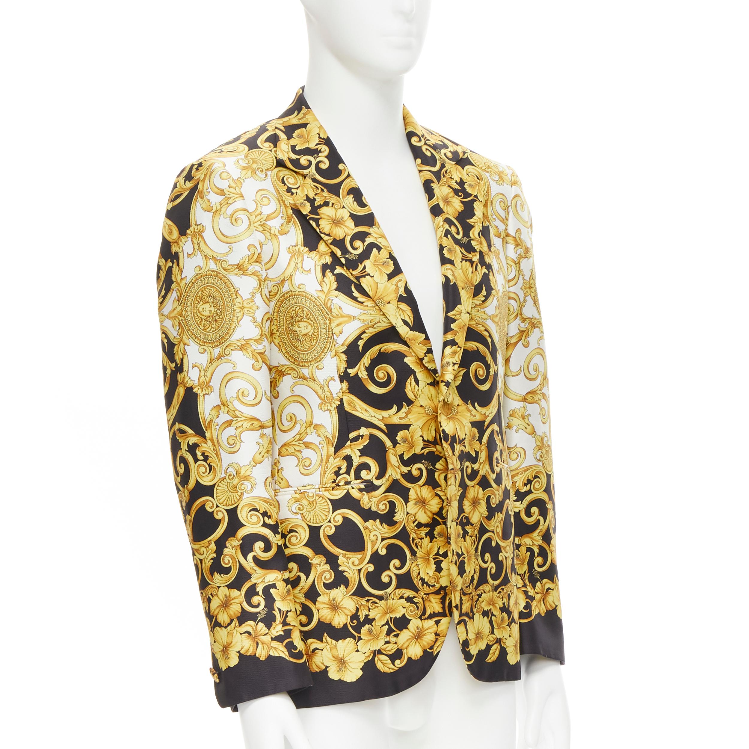 rare VERSACE Barocco Hibiscus Medusa Medallion black gold Palazzo blazer EU48 M 
Reference: TGAS/C00371 
Brand: Versace 
Designer: Donatella Versace 
Material: Silk 
Color: Gold 
Pattern: Floral 
Closure: Button 
Extra Detail: Signature black and