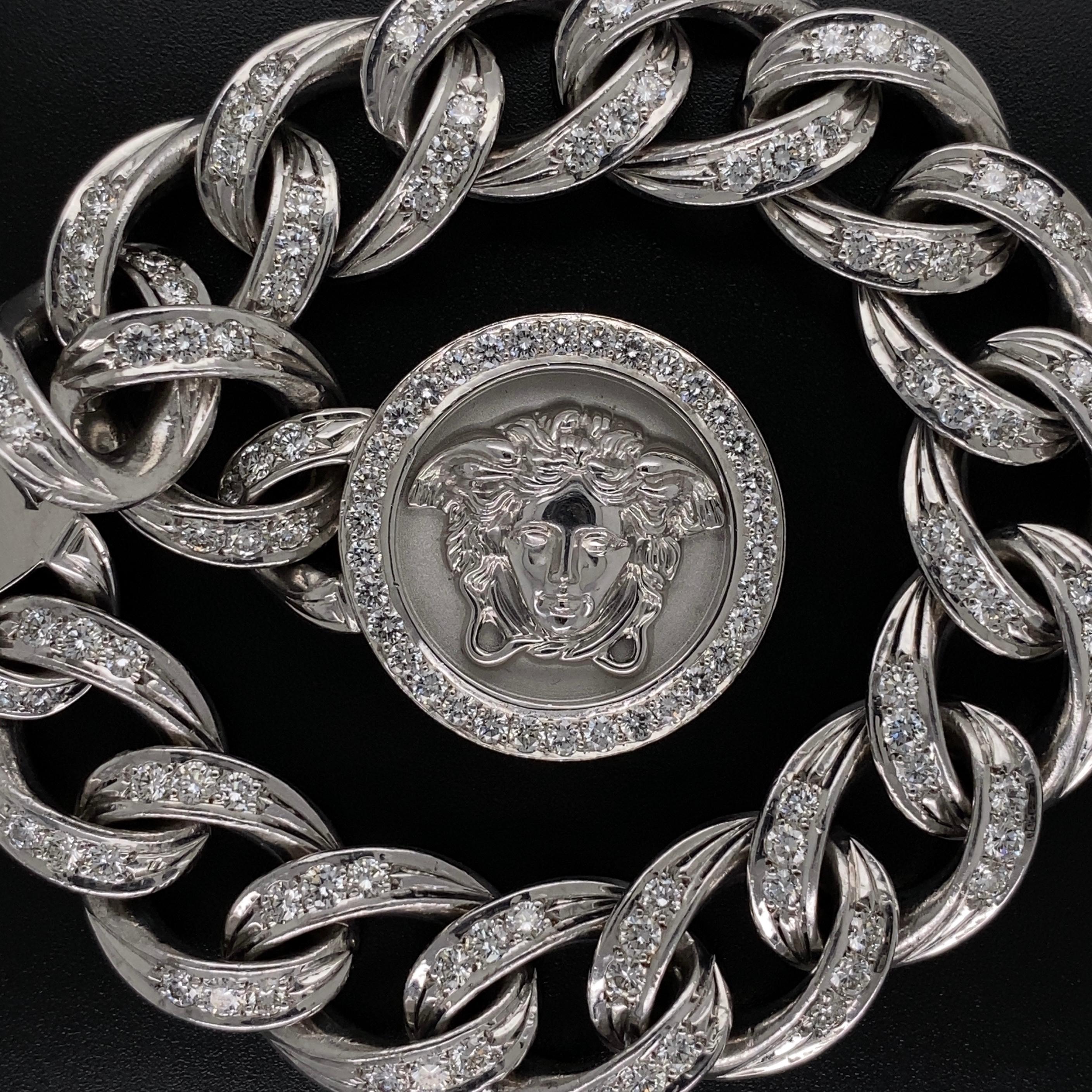 Beautiful finely detailed Versace Medusa Diamond Curb Link Gold Bracelet. Hand set with 136 round brilliant cut diamond weighing approx. 4.50 tcw. Hand crafted in 18 Karat white Gold. Marked: GIANNI VERSACE 18K 750. Approx. 8