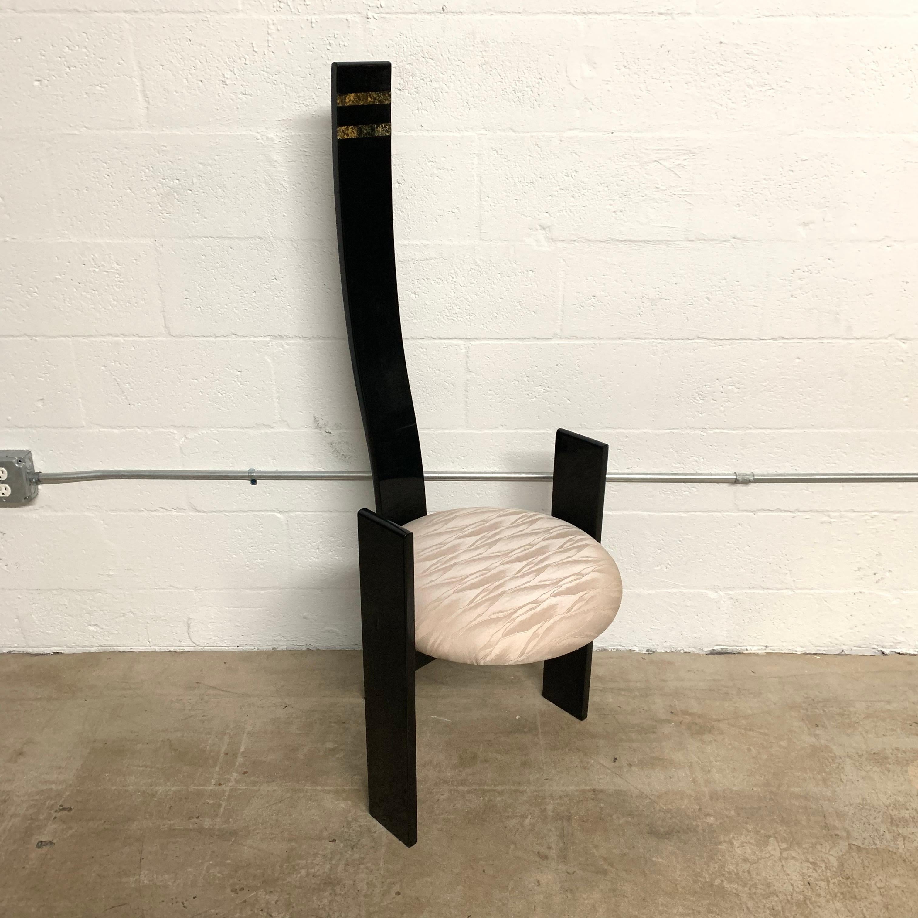 Golem chair rendered in black lacquered wood and inlayed cork detail with an exaggerated high back bent to conform with natural posture of the body terminating as the back leg, and two arms that result as legs creating a unique 3 leg shape, designed