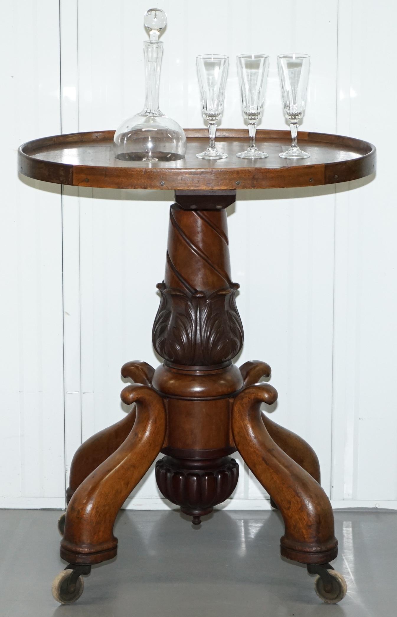 We are delighted to offer for sale this stunning Victorian heavy mahogany with carved column base on wheels side table with built in decanter and three glasses in cut glass crystal

A very rare and good looking drinks serving side table, the piece