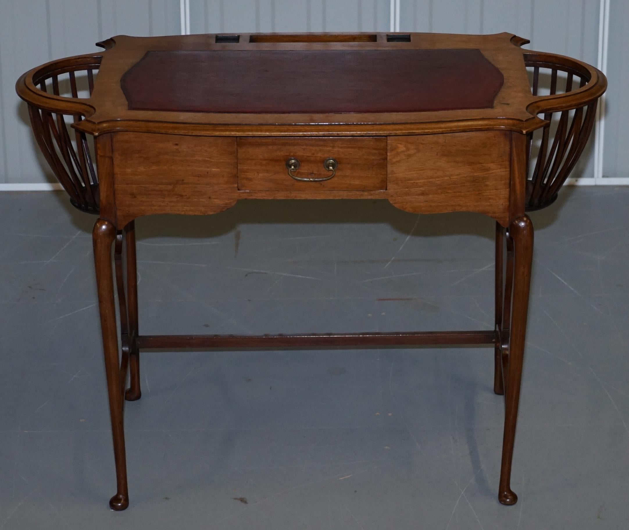We are delighted to offer for sale this very rare Victorian circa 1860 Sheraton Revival light mahogany desk with built in plant baskets and an oxblood leather writing surface

A very rare desk, I have never seen anything like it in terms of having