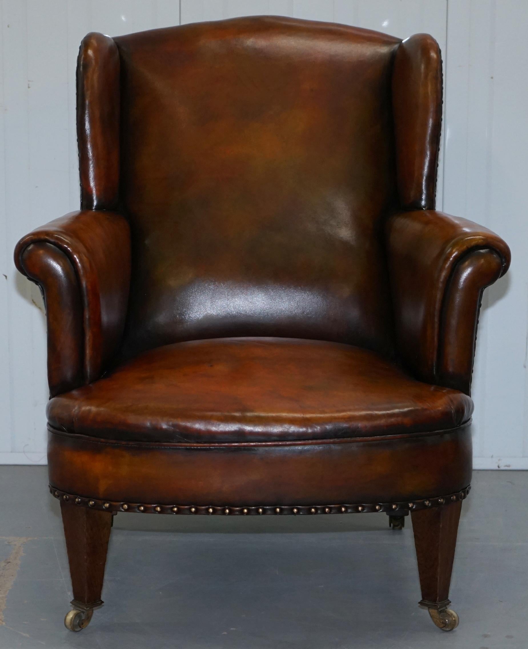 We are delighted to offer for sale this very rare original Hampton & Son’s Pall Mall Victorian circa 1870 fully restored hand dyed leather wingback armchair 

A very good looking well made solid oak framed armchair with original fully restored