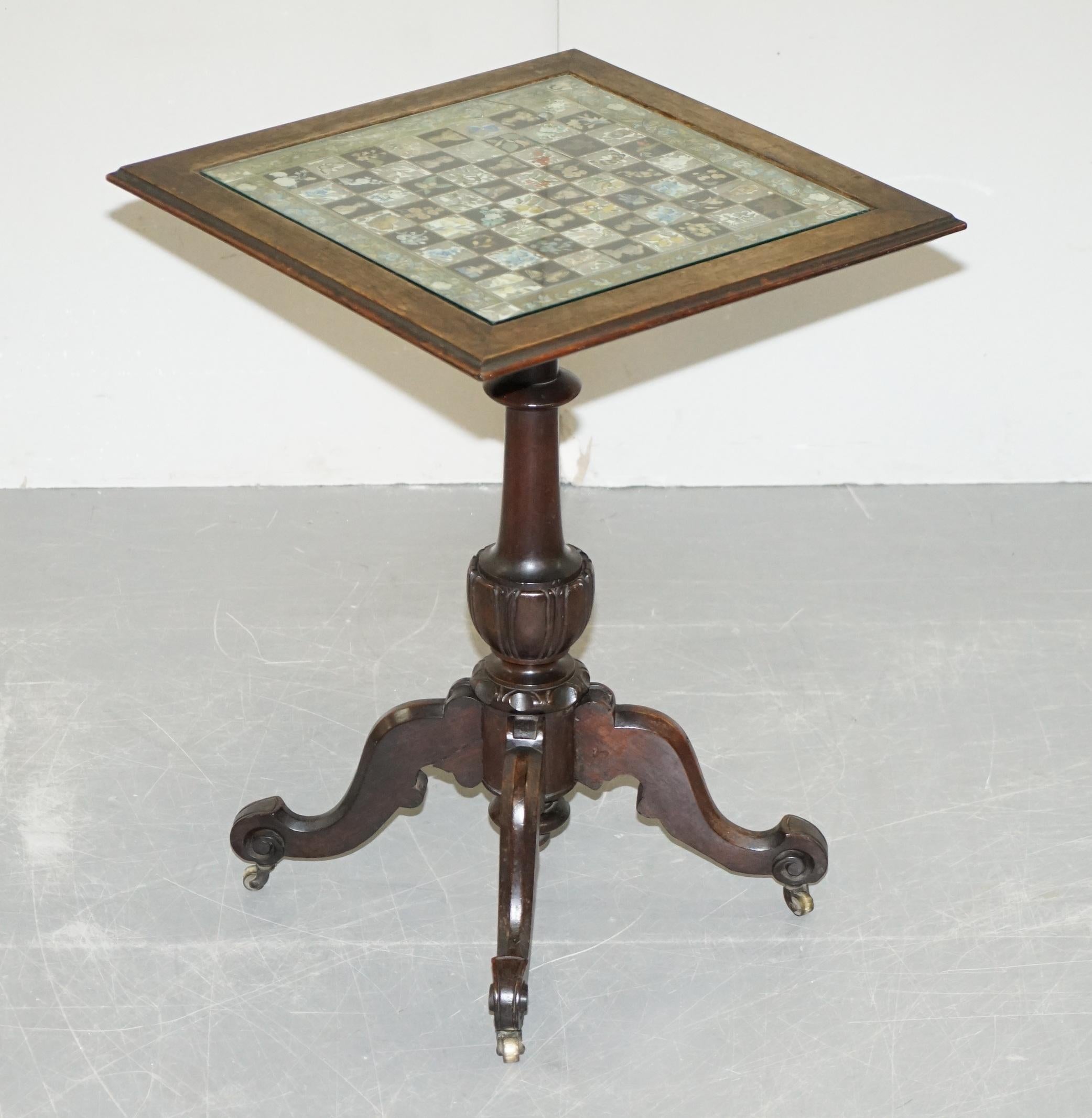 We are delighted to offer for sale this lovely original Victorian Decoupage Chess board table with period castors and glass top

A very good looking and decorative antique piece. Please note the glass Decoupage top is the original and it is broken