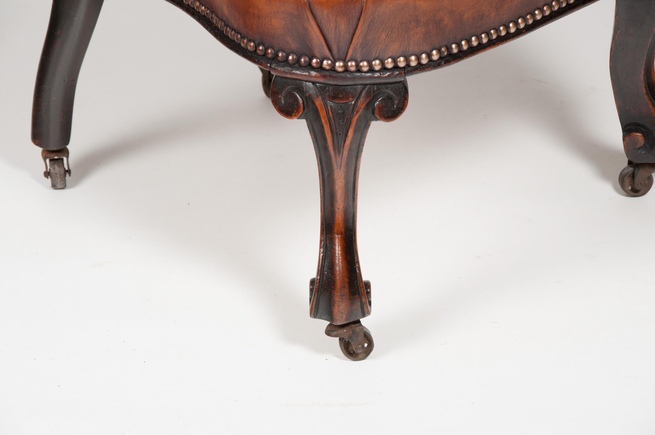A rare Victorian leather upholstered mahogany child’s chair.

English Circa 1880.

This rare child’s chair has a shaped pierced carved back with a leather upholstered seat supported by carved cabriole front legs and out-swept rear legs standing