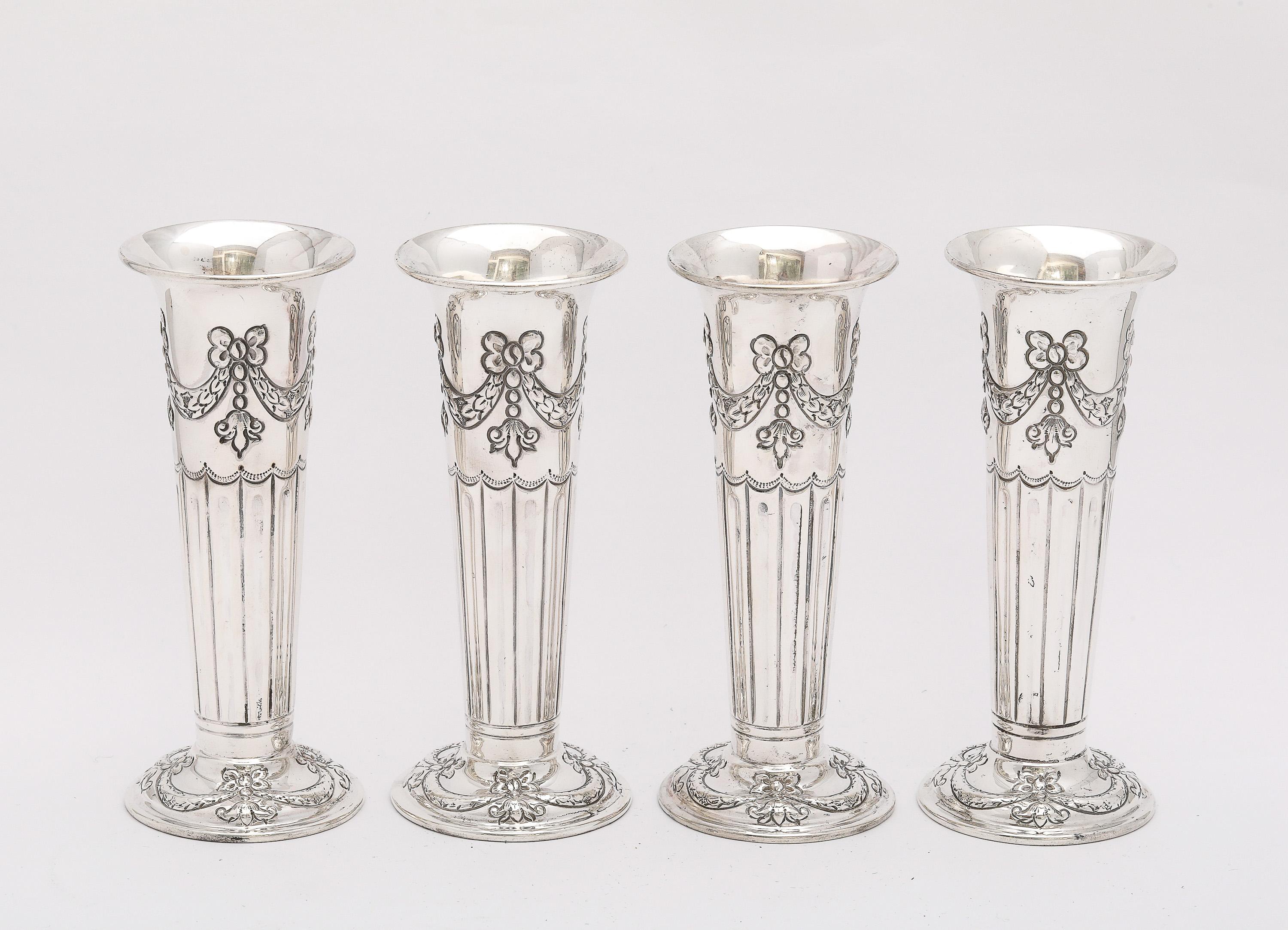 Rare, Victorian Period, Neoclassical Style, set of four (4), matching, sterling silver bud vases, Birmingham, England, year-hallmarked for 1896, Henry Wright Atkin (of Atkin Bros. Co.) - maker. The upper portion of each vase and the base of each
