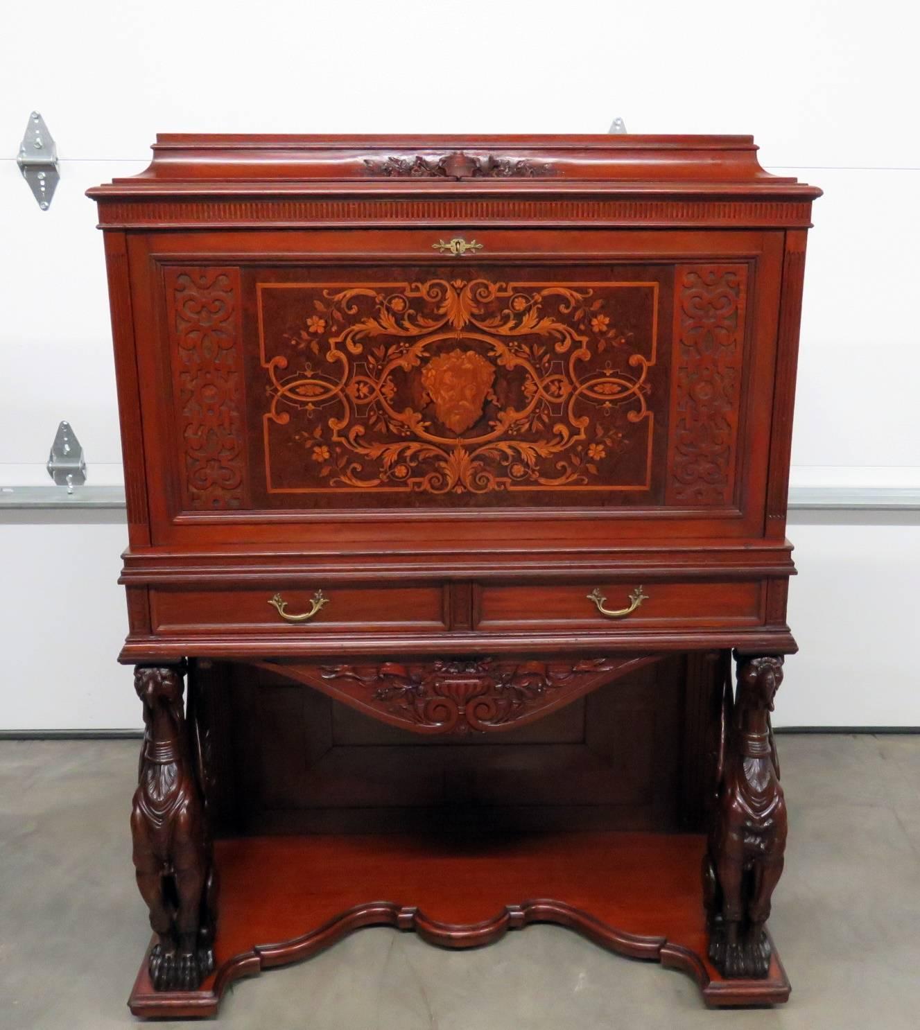 Rare Victorian inlaid Philadelphia desk by Daniel Pabst. Winged griffins with a drop desk over two drawers.
