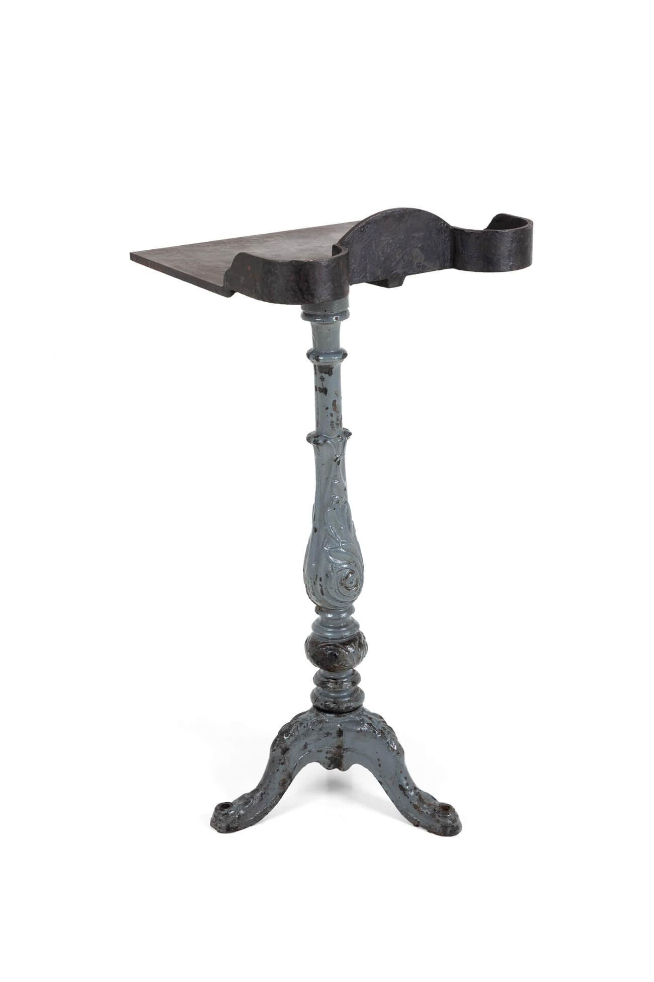 Rare Victorian print factory stand, made of cast iron and with original paint to the stand’s leg. Originally used in a British print factory, inkwells were held in the two curved recesses. Would make the most fabulous front-of-house restaurant bar